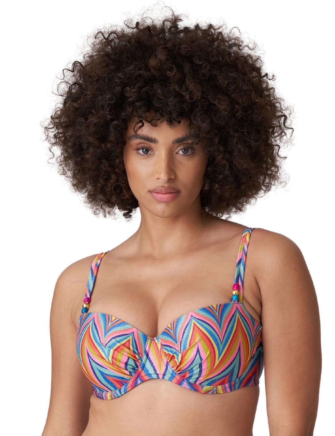 Feel confident you look glamorous with the stylish 70's inspired Kea collection by Prima Donna. This luxurious bikini top is crafted from a stylish metal fibre fabric which creates a glamourous shimmering finish. Convertible shoulder straps allow you to adjust the design from a classic over-the-shoulder style to an elegant halterneck design. The timeless balcony shape highlights the cleavage and the additional padding creates uplift and volume. Underwiring offers added support and a clip fastening ensures a secure fit. Wear with matching swimwear and accessories from the glamourous Kea collection by Prima Donna.