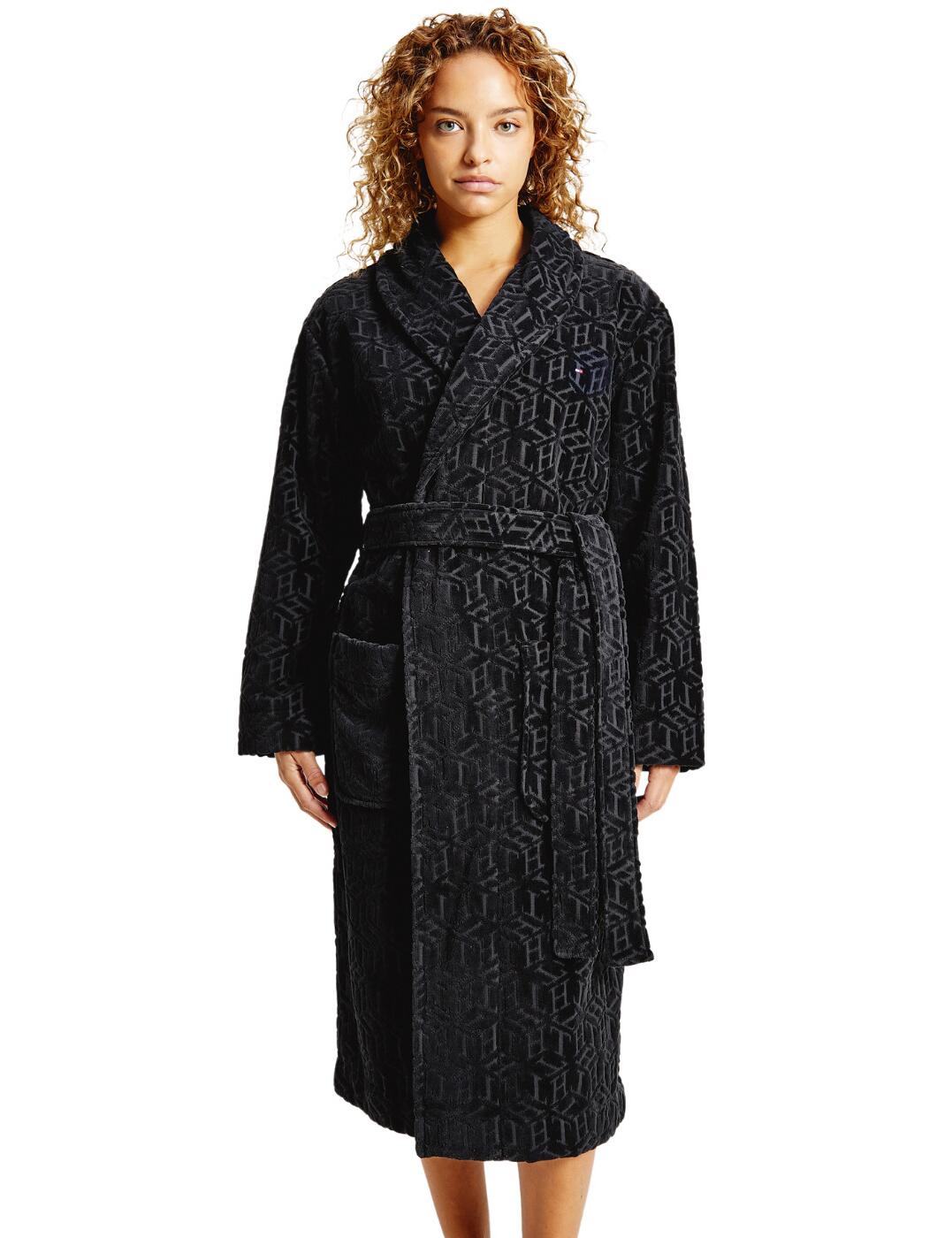 Stay cosy with the Tommy Original bathrobe all-over logo. This gorgeous bathrobe feels luxuriously soft against your skin. Featuring TH branding repeated all over the gown in a subtly contrasting colour that gives this piece a sleek appearance. A small logo is featured on the chest and tape inside the neckline features the Tommy Hilfiger brand colours. Hip pockets allow you to stash your snacks or keep your essentials to hand. The mid-length keeps you feeling snuggly and warm.  Hip pockets Self-tie waist belt Mid-length Country of origin: Turkey Composition: 100% Organic Cotton Listed in UK sizes  54354-97084 UW0UW02596 Dressing Gown
