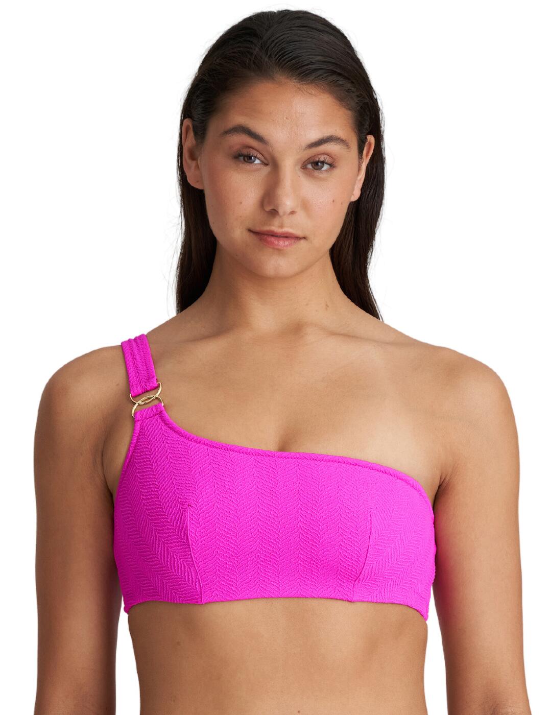 Introducing the Marie Jo Maiao one-shoulder bikini top - the perfect choice for fashion-forward women who desire premium swimwear with a stylish look. The combination of luxurious herringbone fabric and a one-shoulder design creates a high-fashion style. The easy pull-on design allows for effortless dressing while providing ample support via its built-in underwire. Non-adjustable straps give a clean look without sacrificing support or durability, and matching swimwear allow you to create a custom beachside look that will turn heads wherever you go.