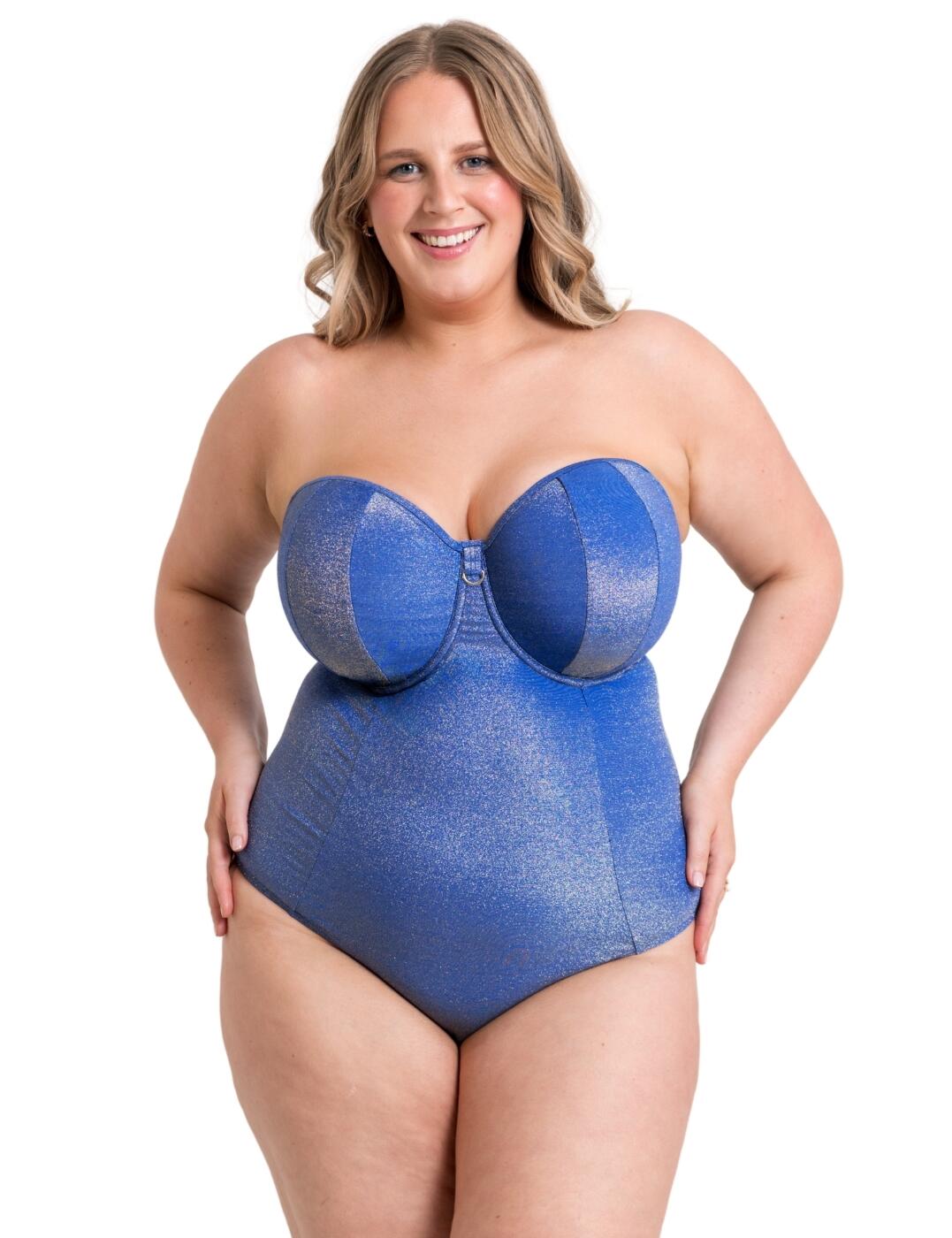 Slip into summer radiance with the Curvy Kate Sapphire Seas swimsuit. Showcasing an elegant sparkle aesthetic that will turn heads at the poolside and stylish D-ring gold charms to add a touch of chic style. With padded cups for an uplifting shape and underwired support, this swimsuit is a must-have on your packing list. This versatile piece will carry you through a plethora of warm weather scenarios from beach days or lazy days around the pool with its adjustable, detachable straps that promise all-day comfort. It ensures a secure fit with the clasp closure and provides good coverage at the rear. What's not to love? Get yours Today.