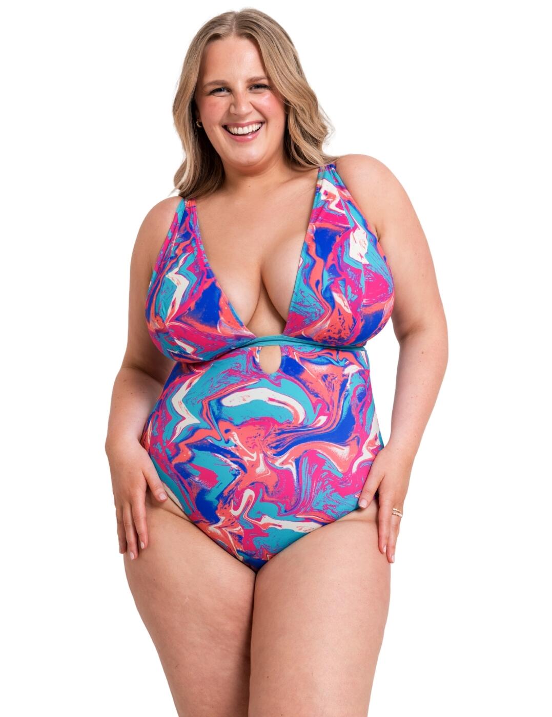 Step out in style on your next holiday with the Curvy Kate Ibiza swimsuit. Discover the beauty of versatility with this piece with its gorgeous reversible design which provides a fun playful print on one side and a plain opaque fabric on the other side allowing you to change up your look with one piece. It is non-padded and features a stunning, deep v-cut neckline and is underwired, crafted to compliment your busts like never before, you will exude confidence when you wear this swimsuit. It has a secure plastic clip fastening to keep everything in place, multiway adjustable straps and moderate rear coverage, promising unparalleled comfort and support.