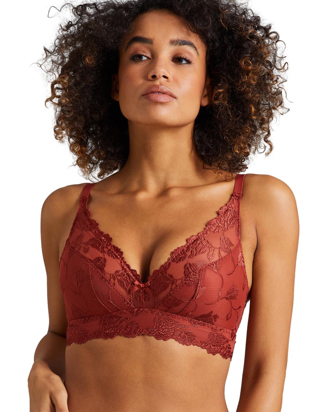 Embrace iconic femininity with Aubade's Softessence collection this season. This luxe triangle bra comes to a deep plunging neckline that highlights your beautiful curves in the way they truly deserve. This piece features delicate feminine embroidery that adorns the cups for an effortlessly opulent appearance that is guaranteed to make jaws drop. This triangle bra has a wire-free design that gives a natural look to the bust whilst still offering support with an innovative under-bust seam, lifted but still comfortable. Fastened at the back with a classic hook and eye closure with fully adjustable straps that enable you to tailor the fit of this piece to your own preference. Pair with the available matching items within Aubade's Softessence range for an irresistible fit.  Seductive and feminine Hook and eye closure 100% Recycled embroidery Sustainable fashion Delicate lace design Wire-free Supportive under bust seam Fully adjustable shoulder straps Plunging neckline Country of origin: Tunisia Composition: Embroidery: 46% Polyamide &pipe; 35% Polyester &pipe; 19% Elastane Composition: Lower embroidery: 47% Polyester &pipe; 38% Polyamide &pipe; 15% Elastane Composition: Top embroidery: 64% Polyester &pipe; 36% Polyamide Composition: Inner lining: 100% Polyester Composition: Top lining: 77% Polyamide &pipe; 23% Elastane Listed in UK sizes  56185-99772-1308527  Triangle Bra