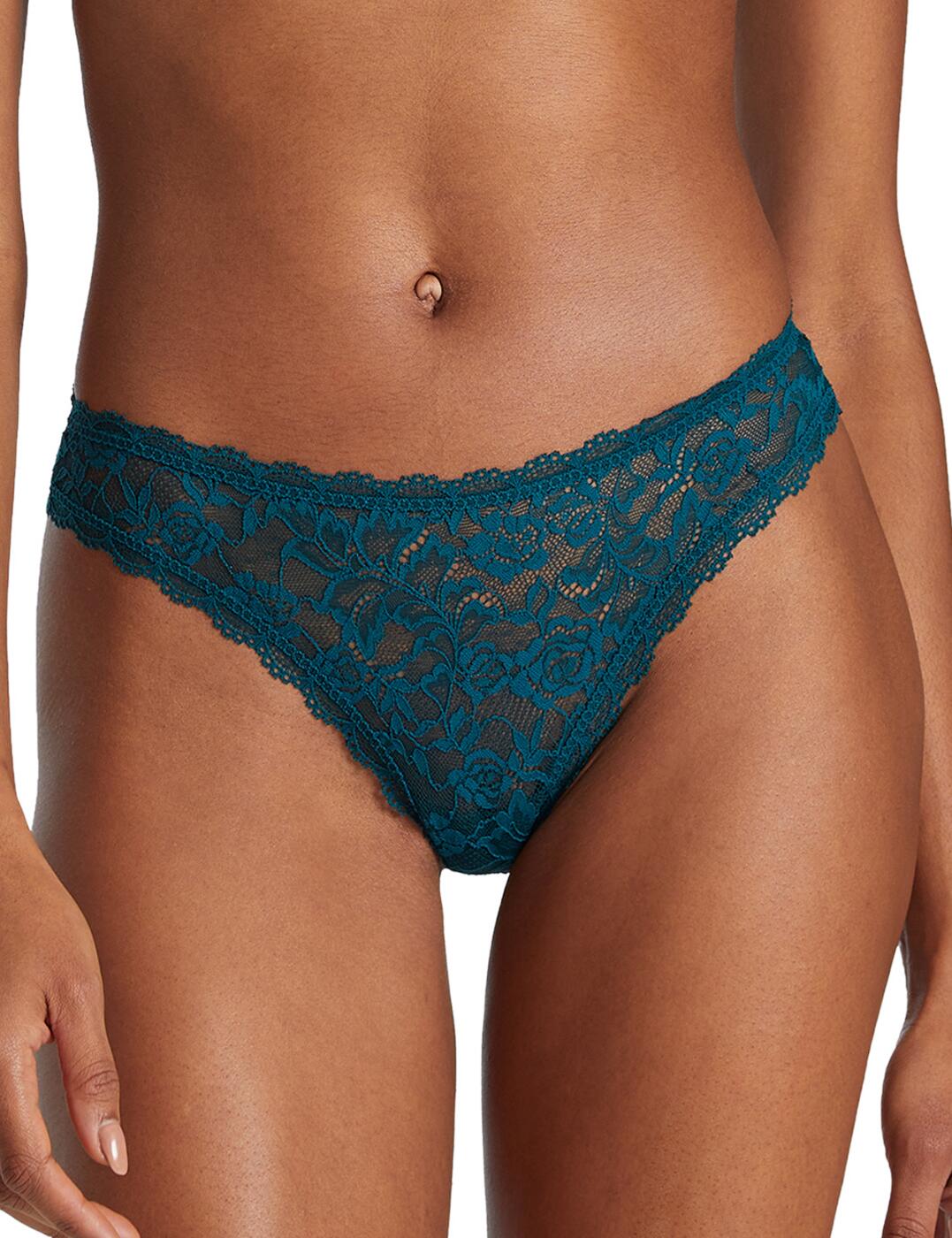 For unbeatable comfort look no further than Aubade's Rosessence collection this season. This tanga brief is crafted with delicate feminine lace with a chic floral motif for a splash of seduction. This piece is cut to a low-rise waist to flatter and hug your curves whilst the minimal rear coverage adds a sensual touch. The scalloped lace trim on this tanga brief adds a flirtatious element. Pair with the available matching items within Aubade's Rosessence line to complete this irresistible set.  Delicate and flirtatious Minimal rear coverage Low-rise design Gorgeous scalloped lace edges Floral lace design Country of origin: Tunisia Composition: Front Lace: 85% Polyamide &pipe; 15% Elastane Composition: Lace Back: 82% Polyamide &pipe; 18% Elastane Composition: Seat: 100% Cotton Listed in UK sizes  56686-100462-1303163 HK26 Tanga Brief
