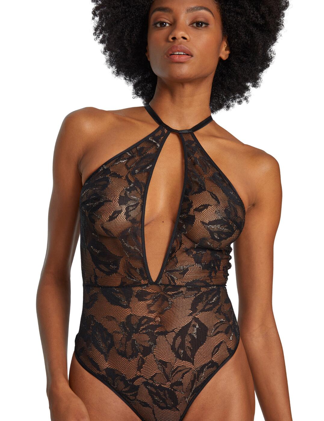 The sensual Twist and Love collection from Aubade will add a touch of excitement to any lingerie collection. This statement body has a sexy bondage-inspired design and features multiple straps and an open back with harness-style straps. The choker-style neck adds to the seductive style and the cut-out front highlights your alluring cleavage. Minimal rear coverage with a thong style shape emphasises your beautiful curves. The semi-sheer floral lace fabric adds a subtle feminine finish whilst seductively showing the skin beneath. G-hook fastenings allow for easy wear and the adjustable straps ensure the perfect fit.  Sexy bondage-inspired design Luxurious semi-sheer lace Non-padded cups Non-wired Seductive choker style neck Cut-out front detail Open back with harness-style straps Adjustable straps Minimal rear coverage Luxurious gold style ring detail G-hook fastenings Country of origin: Tunisia Composition: 65% Polyamide &pipe; 20% Metallic Thread &pipe; 15% Elastane Listed in UK sizes  56988-100823-1307101 P086R Body