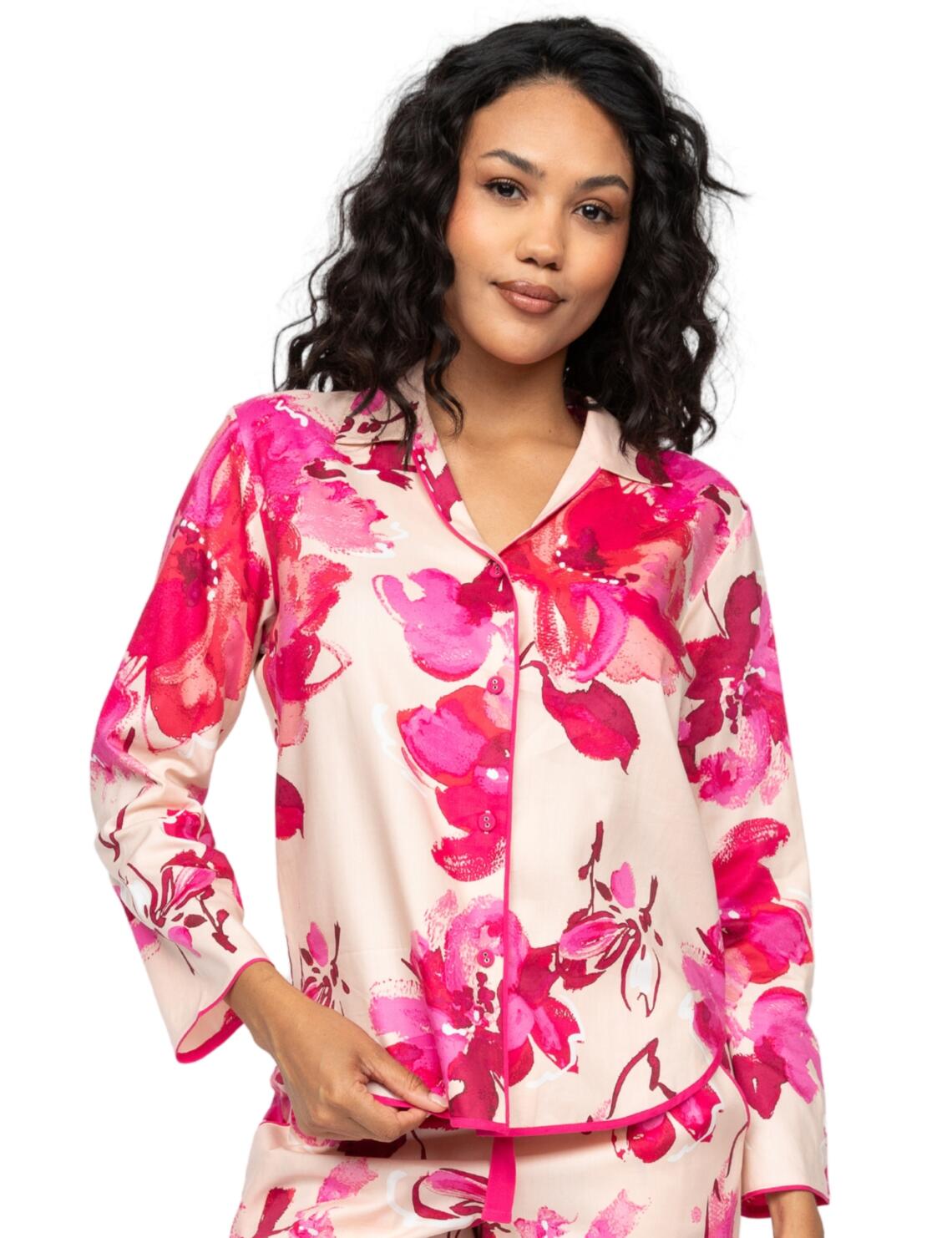 Upgrade your sleepwear with the Aria floral print pyjama top by Cyberjammies. Designed to combine unparalleled comfort with timeless elegance, this pyjama top is crafted from ultra-soft fabric, promising a dreamy night's sleep. The sophisticated floral print is complemented by full-length sleeves and a classic one-piece collar, offering a flattering fit that exudes ageless, effortless style. A vibrant modal trim lines the chic shaped bottom hem, adding a feminine twist when paired with the modern button-up design. Whether you're lounging on a lazy Sunday or settling down for a sumptuous slumber, this pyjama top pairs perfectly with matching Aria sleepwear for an indulgent bedtime look.