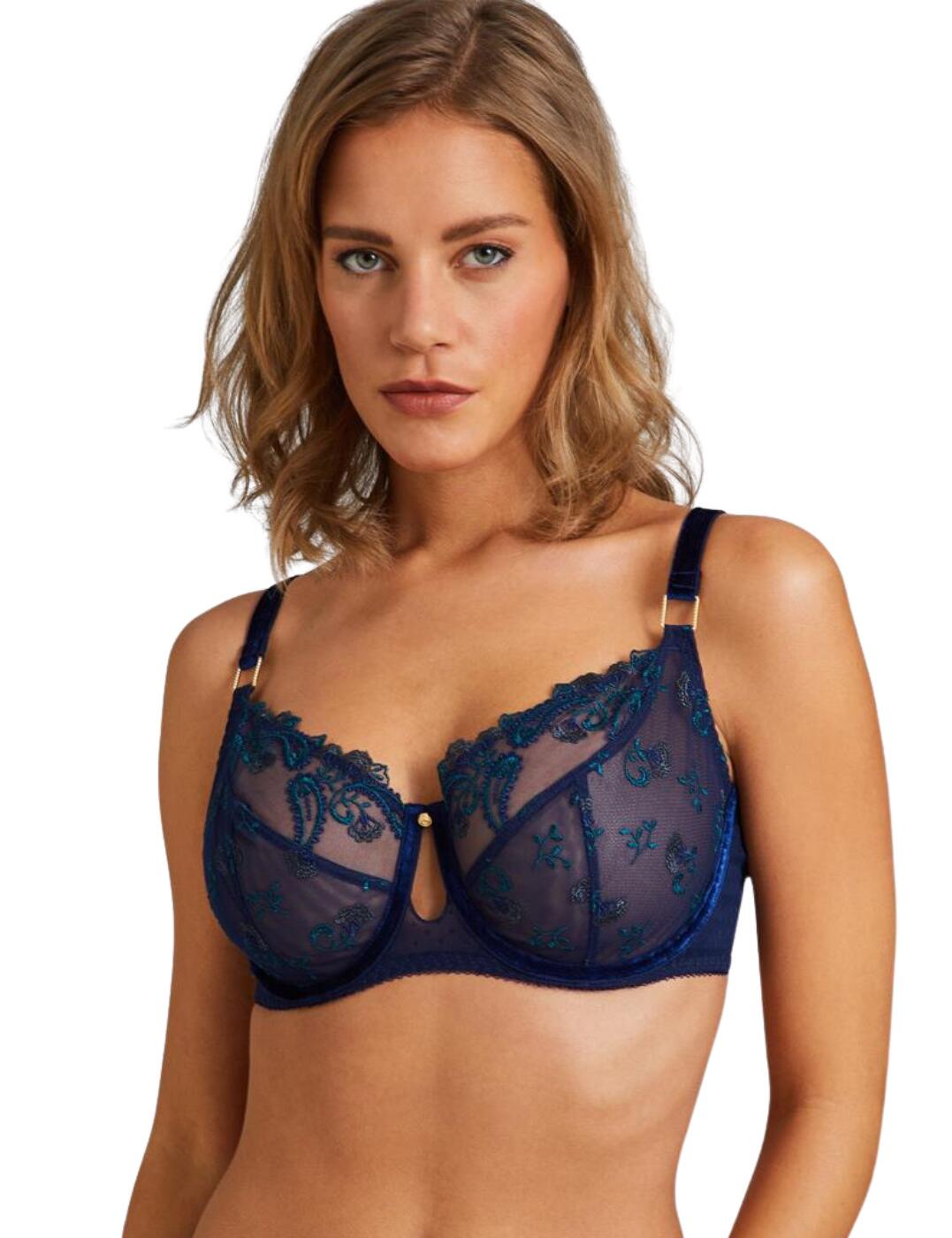 The romantic Velvet Memories collection by Aubade combines classic lingerie designs with luxurious velvet details. This indulgent bra is crafted from a seductive semi-sheer tulle that seductively shows a hint of skin. The soft non-padded cups boast delicate floral embroidery for a subtle feminine feature. Premium velvet adorns the straps and underwire for the utmost luxurious finish. Complete the look with coordinating lingerie from the glamorous Velvet Memories series by Aubade.  Romantic floral embroidery Full cup design Semi-sheer tulle Underwired Non-padded soft cups Adjustable shoulder straps Hook and eye closure Country of origin: Madagascar Composition: Embroidery: Combination of Polyamide & Polyester Composition: Lining: 100% Polyester Composition: Main: 82% Polyamide &pipe; 18% Elastane Listed in UK sizes  57021-100873-1307661 RBF13 / RBF13-1 Full Cup Bra