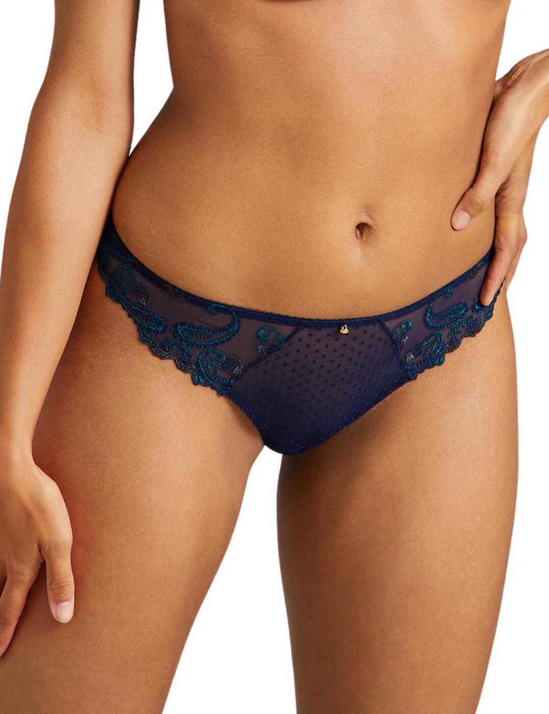 Add a touch of luxury to your lingerie collection with the Velvet Memories collection by Aubade which flaunts luxurious velvet details and elegant gold-toned embellishments. This cheeky tanga brief offers minimal rear coverage and a low-rise waist to highlight and emphasise your beautiful curves. The premium tulle seductively shows a glimpse of skin and the sexy cut-out rear detail is finished with a luxurious velvet border. Matching lingerie is available from the sensual Velvet Memories collection by Aubade.  Seductive semi-sheer tulle Luxurious floral embroidery Sexy minimal rear coverage Flirty cut-out detail with a velvet finish Low-rise waist Matching lingerie available Country of origin: Madagascar Composition: Embroidery: 43% Polyamide &pipe; 38% Polyester &pipe; 19% Elastane Composition: Gusset: 100% Cotton Composition: Main: 82% Polyamide &pipe; 18% Elastane Listed in UK sizes  57026-100878-1307599 RB26 Tanga Brief