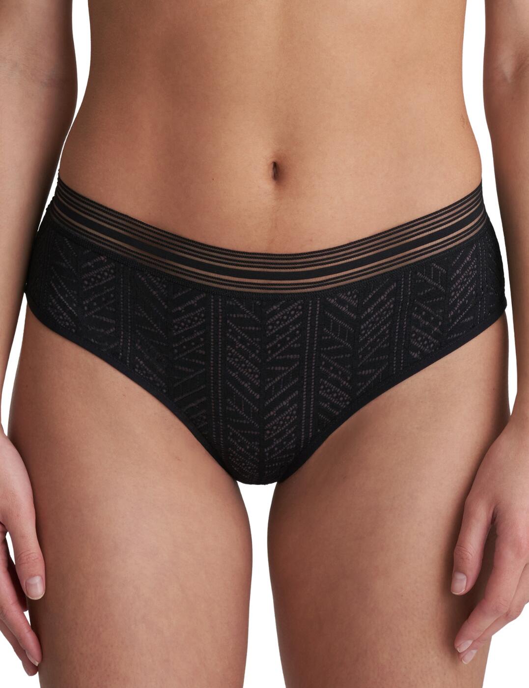 These playful hotpants from the Richard range at Marie Jo is a wonderfully modern lingerie piece you'll want in your collection. They are crafted from a soft trendy geometric lace at the front for a cool vibe, whilst the back is made from an airy tulle for added comfort. The hotpant style gives a shorts-style cut with great coverage and a fuss-free wear. The rear is smooth with clean-cut edges for an invisible look under your clothing.  Modern and comfy design Trendy geometric lace Soft, smooth tulle rear Clean-cut rear finish for no VPL Contrasting waistband Moderate rear coverage Low rise waist Composition: 77% Polyamide &pipe; 18% Elastane &pipe; 5% Cotton Listed in UK sizes  50815-91775-1207976 0522112 Brief