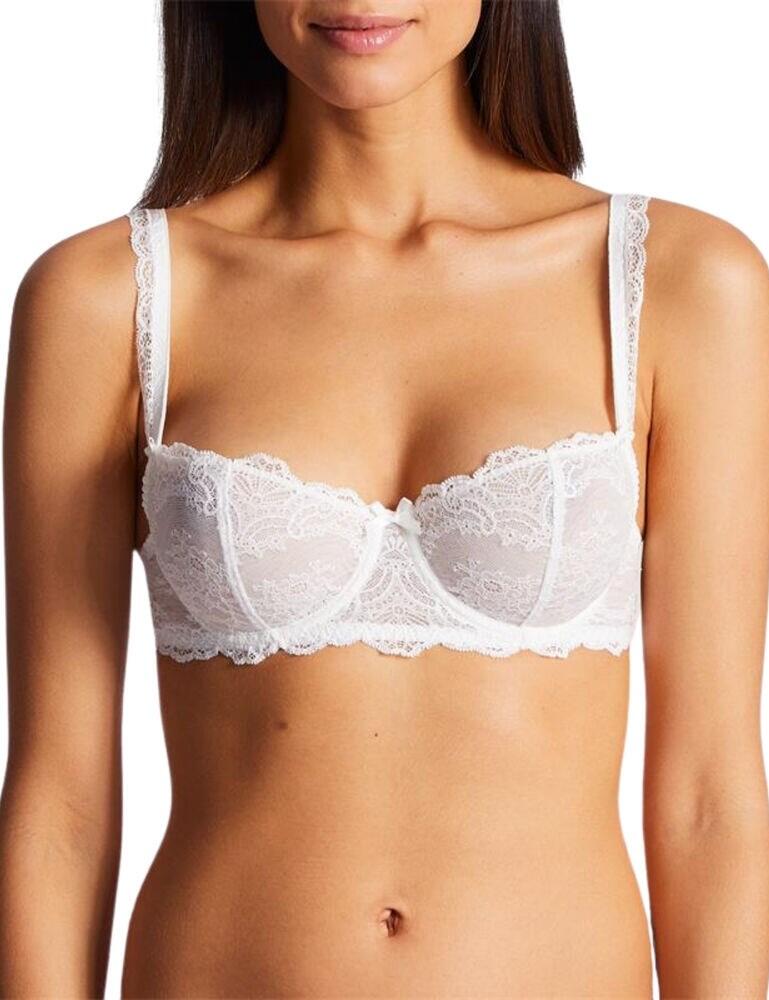 Feel utterly stunning in the Danse Des Sens range by Aubade, featuring this half cup bra. This bra is adorned in delicate lace throughout, from gorgeous detail on the cups to feminine scalloping on the straps and underband. The popular half cup style is very flattering and is perfect for anyone who wants to show off their assets but also not show 'too much'. The cups are underwired for support and uplift and non-padded for a natural fit and feel. The straps are adjustable so that you can find your unique fit and this bra secures at the rear with hook and eye closure. Pair with matching items from the Danse Des Sens range for a stunning, feminine look.  Stunning, feminine design Gorgeous lace on the cups and straps Popular half cup style Underwired, non-padded cups Adjustable straps Secures at the rear with a hook and eye Matching co-ordinates available! Composition: Lace - 89% Polyamide &pipe; 11% Elastane, Cup lining - 100% Polyester  Listed in UK sizes  45875-84232-1120127 OG14-6 Half Cup Bra