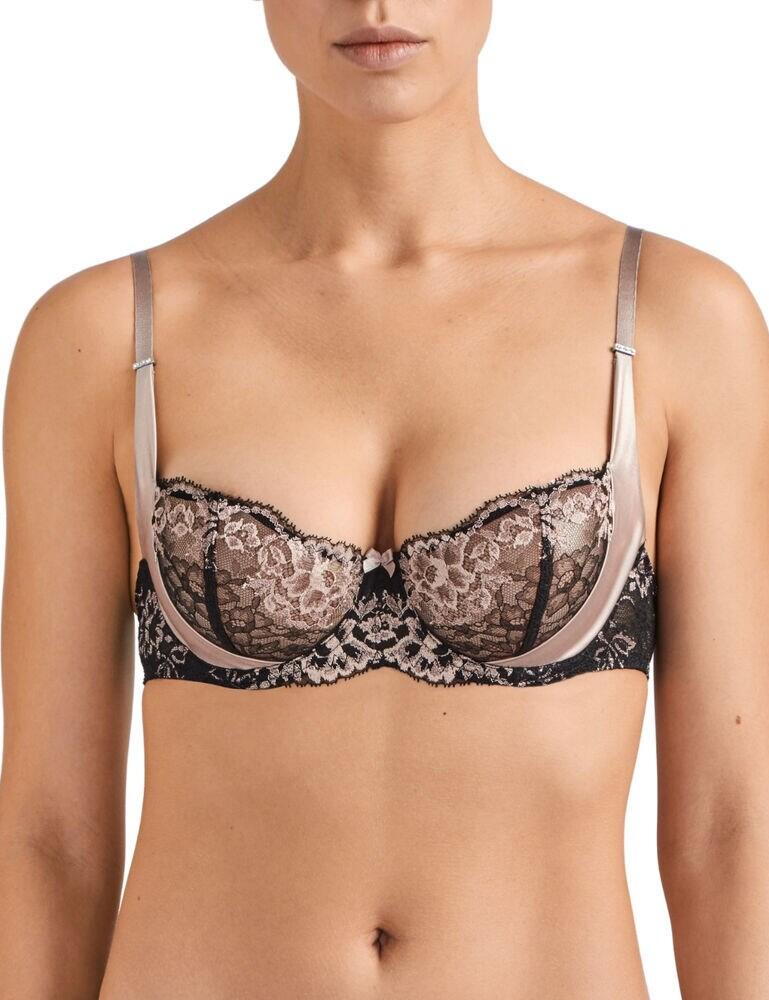 Feel utterly luxurious and chic in this stunning half cup bra from the Femme Glamour range by Aubade. This bra features a stunning floral design, further complimented by intricate lace and silky details. The cups are underwired for support and uplift and non-padded for a natural fit and feel. The shoulder straps are adjustable so that you can find your unique fit. This design secures at the rear with a hook and eye closure. The popular half cup style is very flattering. Pair with matching items from the Femme Glamour range for a chic look.  Stylish, chic design Gorgeous combination of lace, floral patterns and silk accents Underwired cups for support and uplift Adjustable straps for an individual fit Secures at the rear with hook and eye Matching co-ordinates available! Composition: 61% Polyamide &pipe; 39% Polyester Listed in UK sizes  45930-84351-1121244 MD14  Half Cup Bra