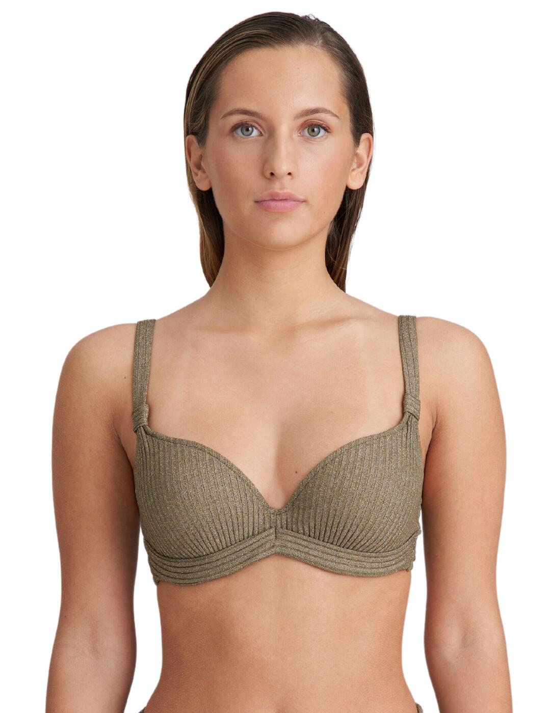 Indulge yourself with the epitome of timeless elegance with the Marie Jo Tinjis padded plunge bikini top. This luxurious swimwear piece is a must-have for the sophisticated woman who values both quality and style. The lightly padded, underwired cups of the Tinjis bikini top provide just the right amount of support and shape, ensuring a flattering silhouette that will make heads turn. The timeless plunge style and flattering neckline add a touch of allure, while the wide underband offers a secure and supportive fit that will make you feel confident and comfortable all day long. The gorgeous gathered fabric detail on the adjustable shoulder straps offer a subtle yet eye-catching design. Pair with the available matching coordinates from the Tinjis collection for the full look.