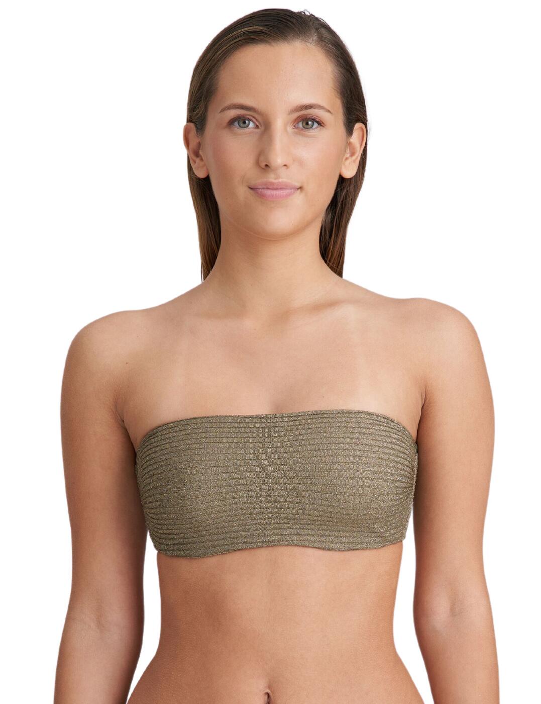 Indulge in the epitome of luxury and sophistication with the Marie Jo Tinjis padded strapless bikini top. Featuring lightly padded, wireless cups for ultimate comfort, this bikini top ensures a flawless fit that embraces your curves in all the right places. With its strapless design, the Marie Jo Tinjis bikini top offers more than just a flattering silhouette. Embrace the sun-kissed look without the worry of tan lines, allowing you the freedom to soak up the sunshine in style. Crafted from a premium shimmering fabric, this swimwear piece exudes sophistication and is part of a chic collection that offers a range of coordinating pieces.  Lightly padded cups Timeless strapless design Simple pull-on design Eye catching shimmering fabric Wireless Matching coordinates available Composition: 54% Polyamide &pipe; 29% Polyester &pipe; 9% Elastane &pipe; 8% Metal fibre Listed in UK sizes  62759-108166-1435504 1006918 Padded Plunge Bikini Top