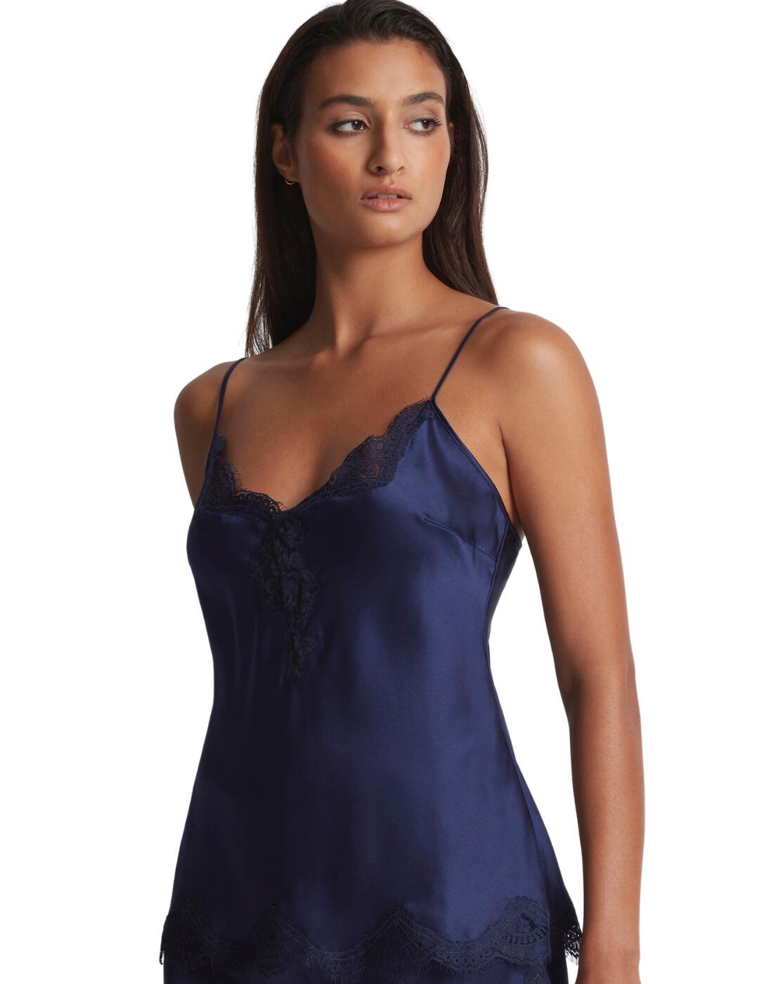 Treat yourself to luxury comforts with the Aubade Toi Mon Amour cami top. An ideal item of nightwear, this lightweight cami is made entirely from soft silk for supreme comfort while you sleep. The adjustable shoulder straps and full length provide a fit that won't slip or pull, making sure your rest is as equally high quality. But this cami top doesn't just have to stay in your bedroom - the unique lace neckline infuses a hint of sensuality, making it a great choice for day or nightwear. Whether you're staying in or heading out, the dreamy silhouette and hint of decoration will have you feeling beautiful and confident. What's more, the scalloped lace neckline adds a unique and timeless touch. If that weren't enough, you can create the perfect look by pairing the Aubade Toi Mon Amour cami top with its matching coordinates.  Sleep cami Soft, lightweight silk Can be worn as day or nightwear Rigid lace inlay on the neckline for a sensual touch Skinny shoulder straps Scalloped lace neckline Full length Adjustable shoulder straps Matching coordinates available Country of origin: China Composition: Fabric: 100% Silk Composition: Lace: 100% Polyamide Listed in UK sizes  61631-106782-1412124 QS38 Camisole Top