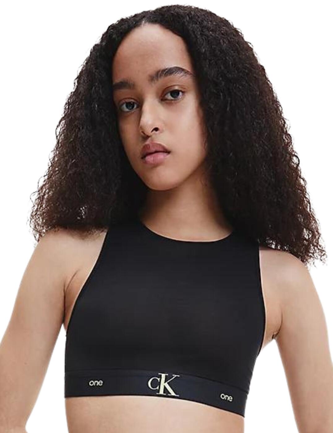 Feel effortlessly stylish with Calvin Klein's CK One collection this season. This bralette is crafted from a soft, semi-sheer jersey material that adds a seductive element to this gorgeous piece. Cut to a high neck for a fashion-forward edge with a smooth-to-the-skin wire-free underband that comfortably sits against your body. For a designer twist look no further than this bralette with Calvin Klein's signature logo featuring on the underband for an edgy addition to this classic piece.  Soft stretch mesh Semi-sheer design Unlined Non-padded Wire-free, so comfortable High neckline for an on-trend finish Classic Calvin Klein logo detailing on underband Country of origin: Sri Lanka Composition: 68% Nylon &pipe; 32% Elastane Listed in UK sizes  57215-101137-1308444 000QF6959E  Bralette