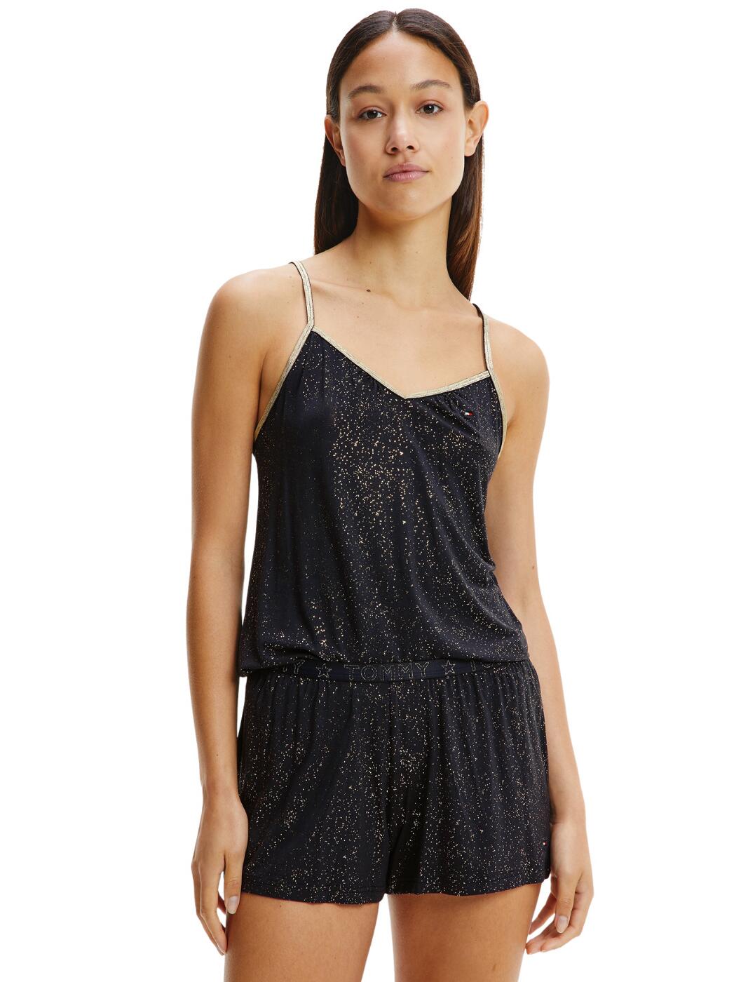 Add a glamourous look to your everyday sleepwear. This stylish Tommy Sparke 2 piece shorts and camisole set from Tommy Hilfiger combines a classic design with an eye-catching metallic shine. The shorts flaunt the iconic Tommy repeated waistband with a modern metallic finish. Adjustable straps and an elasticated waistband offer a unique and the utmost comfortable fit.  Flirty camisole and shorts set Luxurious Tommy Sparkle collection Adjustable shoulder straps Short length Country of origin: Thailand Composition: 94% Viscose &pipe; 6% Elastane Listed in UK size  53462-95867-1252240 UW0UW03244  Pyjamas