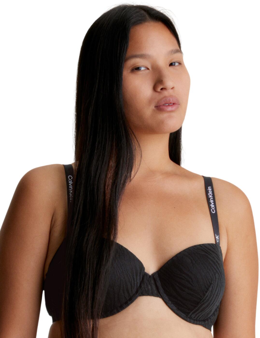 Let your style roar with the Calvin Klein's CK96 balconette bra! Not only does this bra offer comfort, support, and a trendy, modern look, but it is also made with recycled fibres, making it a sustainable choice. With its eye-catching all-over tiger pattern, you ll be sure to stand out in this balconette bra. It has moulded opaque cups and underwired support so you get the best fit and feel possible while feeling confident. And the adjustable shoulder straps convert to a cross-back style, so you can be sure of the perfect fit for any occasion. Plus, it features the signature Calvin Klein detailing on the shoulder straps for an enhanced look. Whether you're looking for a casual, everyday look or an amplified classic, the Calvin Klein CK96 balconette bra is the perfect choice.