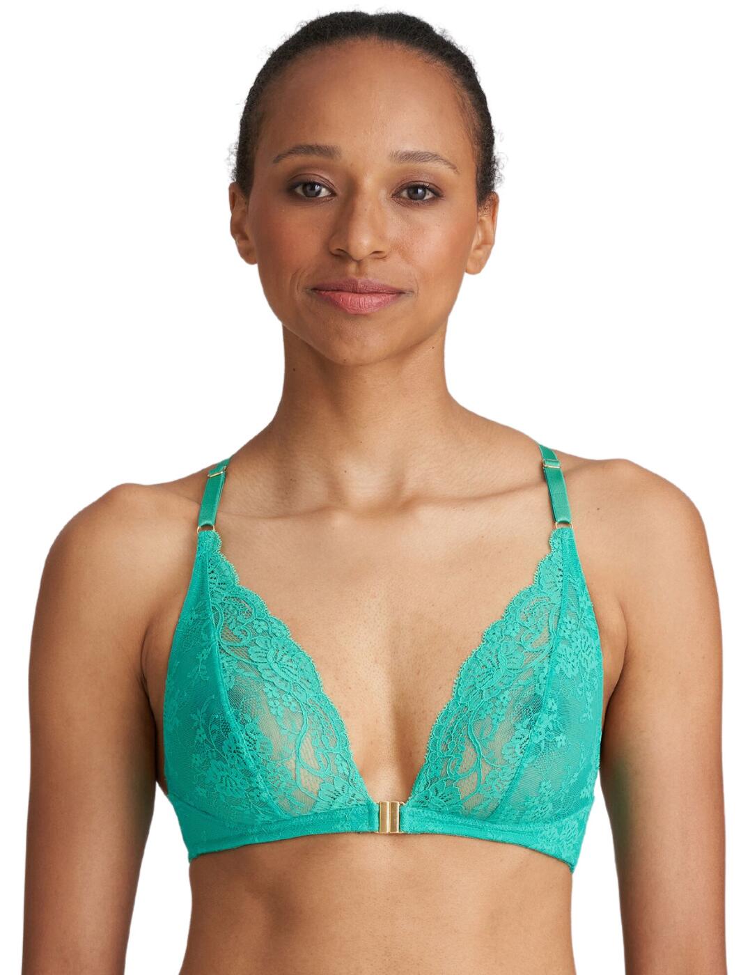 The Marie Jo Melipha bralette is the epitome of effortless elegance. Designed with the sophisticated woman in mind, this bralette combines comfort and style seamlessly. The non-wired cups provides all-day comfort, allowing you to move with ease while still feeling supported. Featuring a flattering neckline to accentuate your natural curves and providing a subtle yet alluring look. The luxury lace-covered cups add a touch of femininity, creating a sense of timeless beauty. The non-padded cups allow your natural shape to shine through, while the pretty metallic gold charm at the center front adds a touch of luxury and sophistication. Turn heads with the intricately designed lace-paneled back with the adjustable shoulder straps also providing a customised fit. Coordinate your look with the available matching Melipha pieces, creating a seamless and elegant ensemble. PLEASE NOTE: This item is restricted from shipping to the USA by the manufacturer.