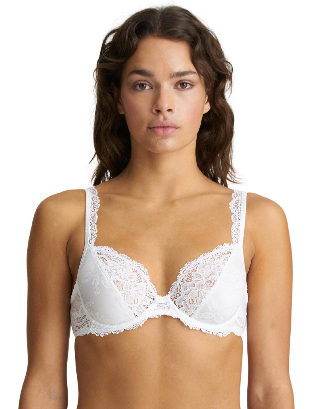 The jaw-dropping elegance of this Sylvia bra by Marie Jo is sure to fill you with confidence in your everyday life. The delicate floral lace covers the band, half of the cups, and even extends to the front of the adjustable shoulder straps. It creates a romantic and classy look. The underwired cups in a fully covered design are sure to make you feel comfortable, while the deep plunging neckline gives you the freedom to wear this bra with any outfit. A cute bow in between the breasts completes the look.  Full-cup design Deep plunging neckline Gorgeous lace material Adjustable shoulder straps Hook and eye back closure Underwired Non-padded Country of origin: China/Nanhai Composition: 87% Polyamide &pipe; 13% Elastane Listed in UK sizes  53991-96678-1250484 0102460 Full Cup Bra