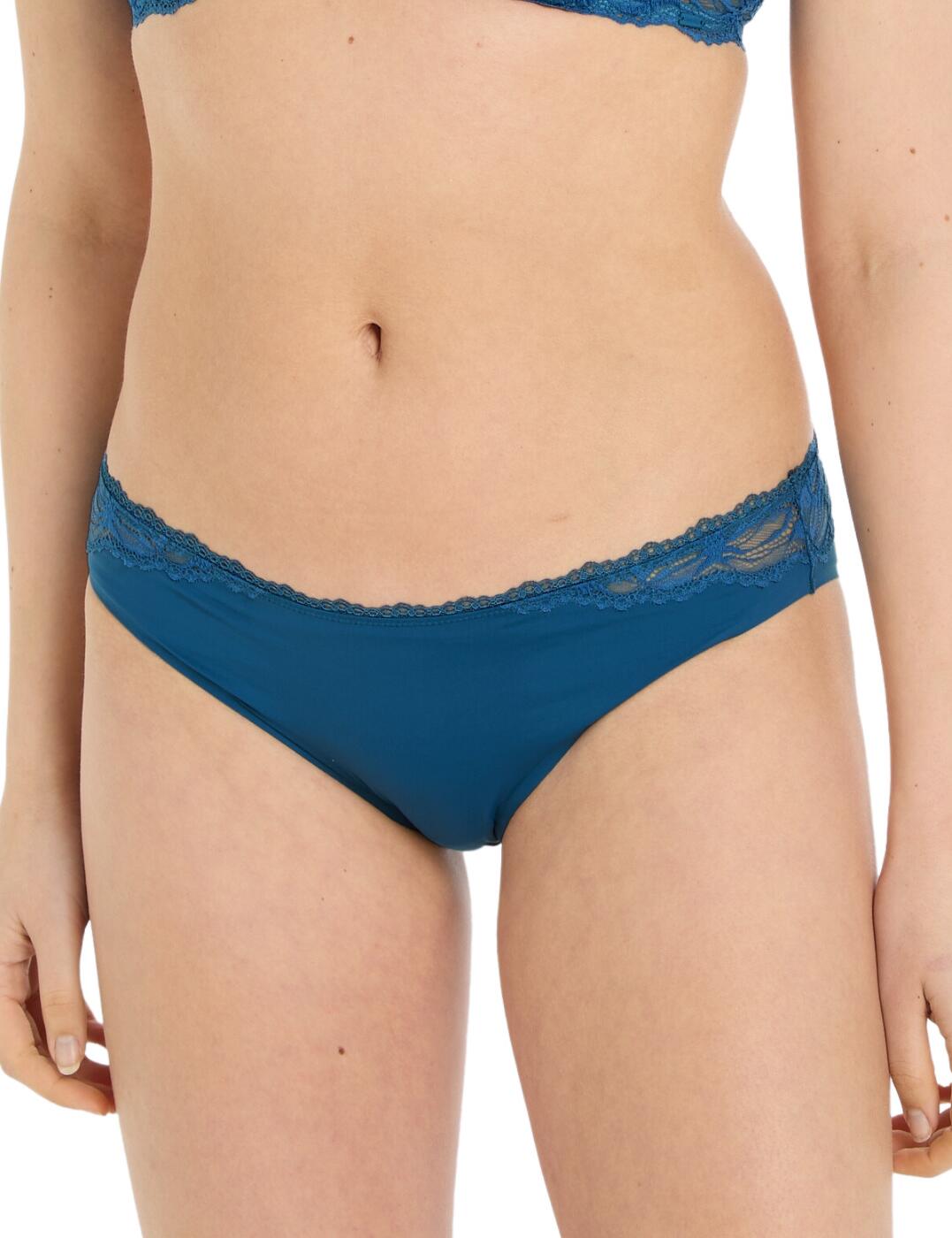 As unique as you are, the Calvin Klein Seductive Comfort brief are more than just your everyday underwear. These briefs are a fusion of classic and contemporary, featuring elegant mid-rise waist and moderate rear coverage — designed to provide all-day comfort. Glamourous lace detailing and scalloped edges accentuate the more sheer panels, creating a beautiful lingerie piece that will make you feel empowered and at ease. It's a timeless piece that can be mixed and matched with its matching lingerie set for a complete. With the subtle Calvin Klein branded tab as a finishing touch, this brief redefines seduction and is perfect for any woman that seeks stylish lingerie.  Elegant brief Mid-rise waist Moderate rear coverage Beautiful lace detailing Scalloped edges Sheer panelling Calvin Klein branded tab Matching lingerie available Country of origin: Thailand Composition: 86% Nylon 14% Elastane Listed in UK sizes  62083-107369-1422640 000QF6398E Brief