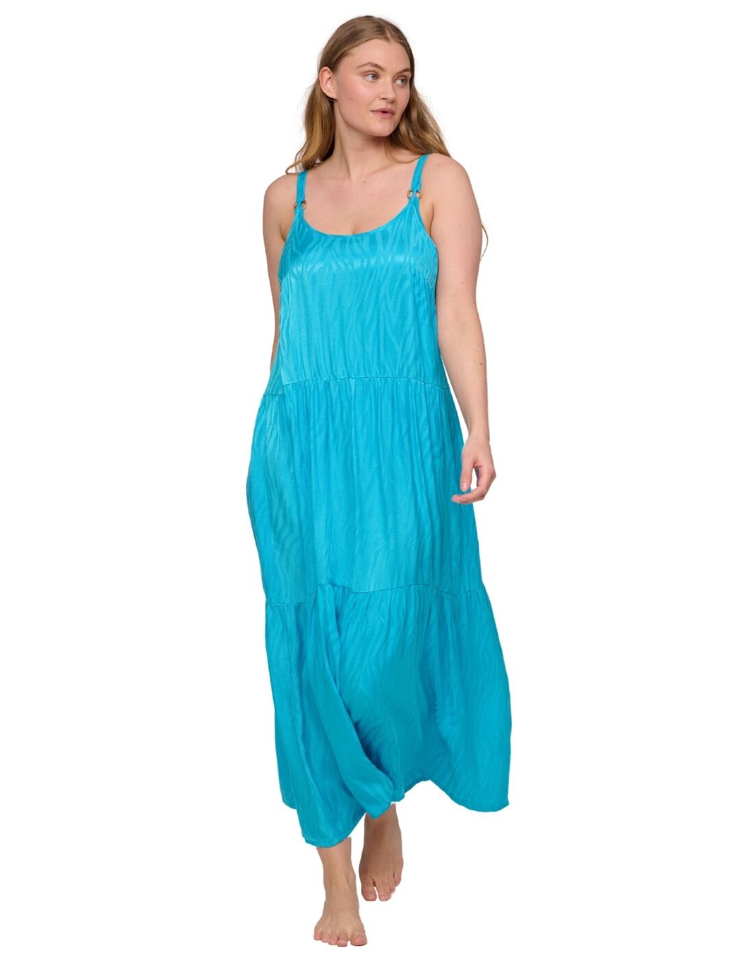 Exude effortless elegance from sunrise to sunset with this long swimwear dress from Prima Donna Swim's captivating Kochi collection. Adorned with a chic subtle wave-inspired design, this must-have dress is a luxury essential sure to redefine any holiday wardrobe. It flatters your figure with a relaxed silhouette, offering all-day comfort with a feminine rounded neckline and chic metallic rings at the apex to add touches of modern glamour. With thin, adjustable straps for a tailored fit, this maxi dress is your go-to for poolside days and romantic evenings alike, perfect as a beach cover-up over matching Kochi swimwear or by itself as a statement holiday piece.