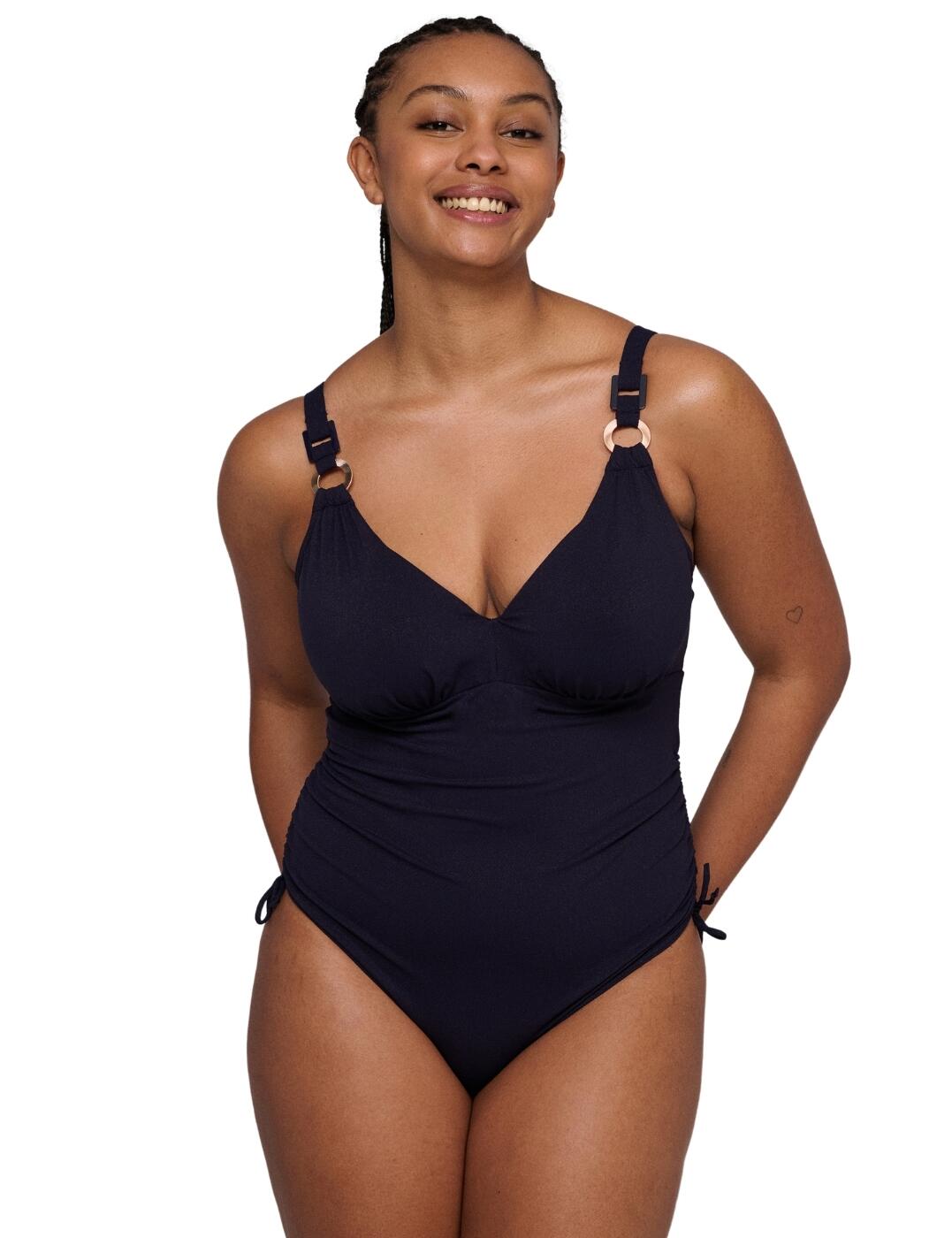 Wrap yourself in luxury in the plunge swimsuit from Prima Donna Swim's Pinner collection. It offers a flattering silhouette with its plunge neckline, high apex and minimalistic design. Fully versatile, this swimsuit features adjustable straps that can be swapped for a halter neck option. The underwired, non-padded cups give you a supportive feel, while the drawstring at the legs gives you customised leg coverage. It exudes a glamorous flair with metallic hardware features on the straps and intricate gathered fabric design on the cups giving an elegant design. Finally, the back clasp closure holds the piece together for a secure feel all day long. Browse the Pinner range for various matching items now!