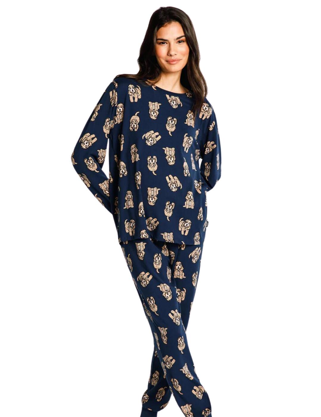 Surround yourself with comfort and cosiness when you purchase the Chelsea Peers long pyjama set! This super stylish set is perfect for all those nights spent lounging around the house. Crafted from soft jersey fabric, these pyjamas are sure to keep you feeling comfortable without compromising on style. The classic long sleeves, crewneck style, regular joggers, and elasticated waistband are not only figure-flattering but also super trendy. To add a bit of charm and cuteness to your look, this set features a cute cockapoo design – these lovelies will surely be the centre of attention! Not only that, the loose arms and cuffed legs add an extra layer of comfort.  Soft jersey pyjamas Cute cockapoo design Classic long sleeves Crewneck style Regular joggers Elasticated waistband Cuffed legs Loose arms Country of origin: Bangladesh Composition: 95% Recycled Polyester &pipe; 5% Elastane Listed in UK sizes  62206-107540 CPNY-TR-21 Pyjama Set