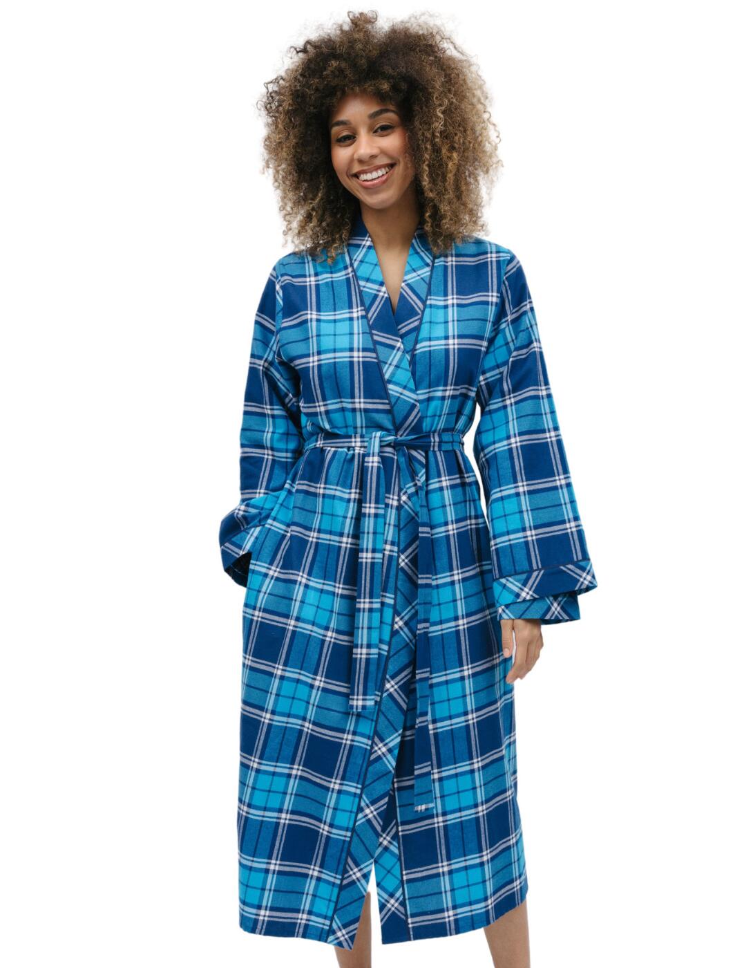 It's time to curl up and get cosy with the Bea range from Cyberjammies. The brushed long dressing gown is designed to encapsulate you in ultimate comfort and style. Lightly brushed for an extra plush feel, this robe is perfect for long evenings spent lounging around the house. The contrasting trim, wrap front kimono style design and convenient side pockets add a touch of sophistication and practicality. Wear it over the matching coordinates for a fashionable and cohesive ensemble! With the Cyberjammies long dressing gown, experience comfort and style all day and all night.  Long dressing gown Collared design Blue check with navy trim Tie, wrap front fastening Long sleeved Front and back length: 120cm Country of origin: India Composition: 100% Cotton Listed in UK sizes  9749-8 9749 Dressing Gown