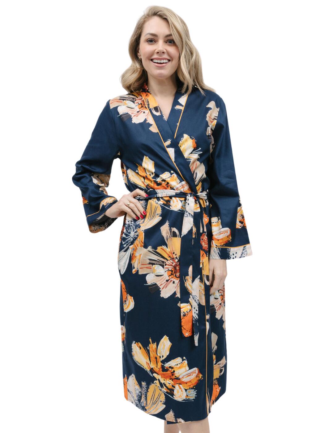 Let sophistication and comfort be your companions with the Cyberjammies Cosmo range. The floral print long dressing gown will enrich your loungewear collection with this exquisite garment that empowers you to relax in style. The navy base, mustard piping and bold brushstroke florals in striking tones are sure to help you radiate confidence. The wrap front kimono-style construction combined with the fabric tie waist is designed for a comfortable fit that flatters your curves. Complete with two side pockets to store small essentials, this dressing gown is the ideal sleepwear cover-up. Pair with the other matching styles from the Cosmo range and turn bedtime into an opportunity to pamper yourself.  Dressing gown Navy floral print with mustard piping Wrap front Fabric tie waist Two pockets Front and back length: 120cm Matching coordinates Country of origin: India Composition: 60% Cotton &pipe; 40% Modal Listed in UK sizes  9800-8 9800 Dressing Gown