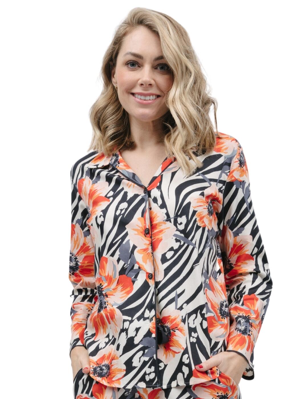 Get ready to embrace your inner wild side with Cyberjammies's Nicole animal floral pyjama top. This top features a unique mix of animal print with vibrant flower accents, blending together fierceness and femininity. Crafted with long sleeves perfect for keeping you snug during cooler nights, this top has a reverse collar and a rounded bottom hem for added style and comfort. To complete this glamourous and loud night-time look, check out some of the matching coordinates also from the Nicole collection.