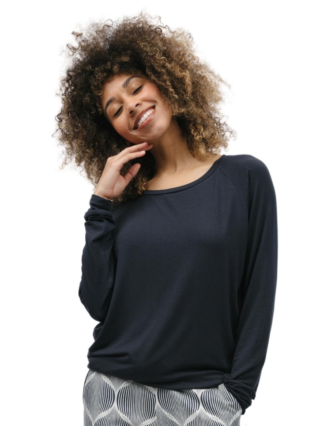 Curl up in comfort this season with the Cyberjammies Nicole pyjama collection! Featuring a solid pyjama top, this soft design allows you to go from desk to bed easily! The top includes long raglan sleeves for added coverage and breathability. You'll never feel restricted again with the loose, relaxed fitting, all completed with self-trim fabrics in a stunning style. Plus, why not pair with your favourite or coordinating pyjama bottoms for the ultimate nighttime look?  Slouch pyjama top Long raglan sleeves Self-trim fabric trim Relaxed fit Matching coordinates available Country of origin: India Composition: Top: 95% Modal &pipe; 5% Elastane Composition: Pant: 60% Cotton &pipe; 40% Modal Listed in UK sizes  9777-8 9777 Loungewear