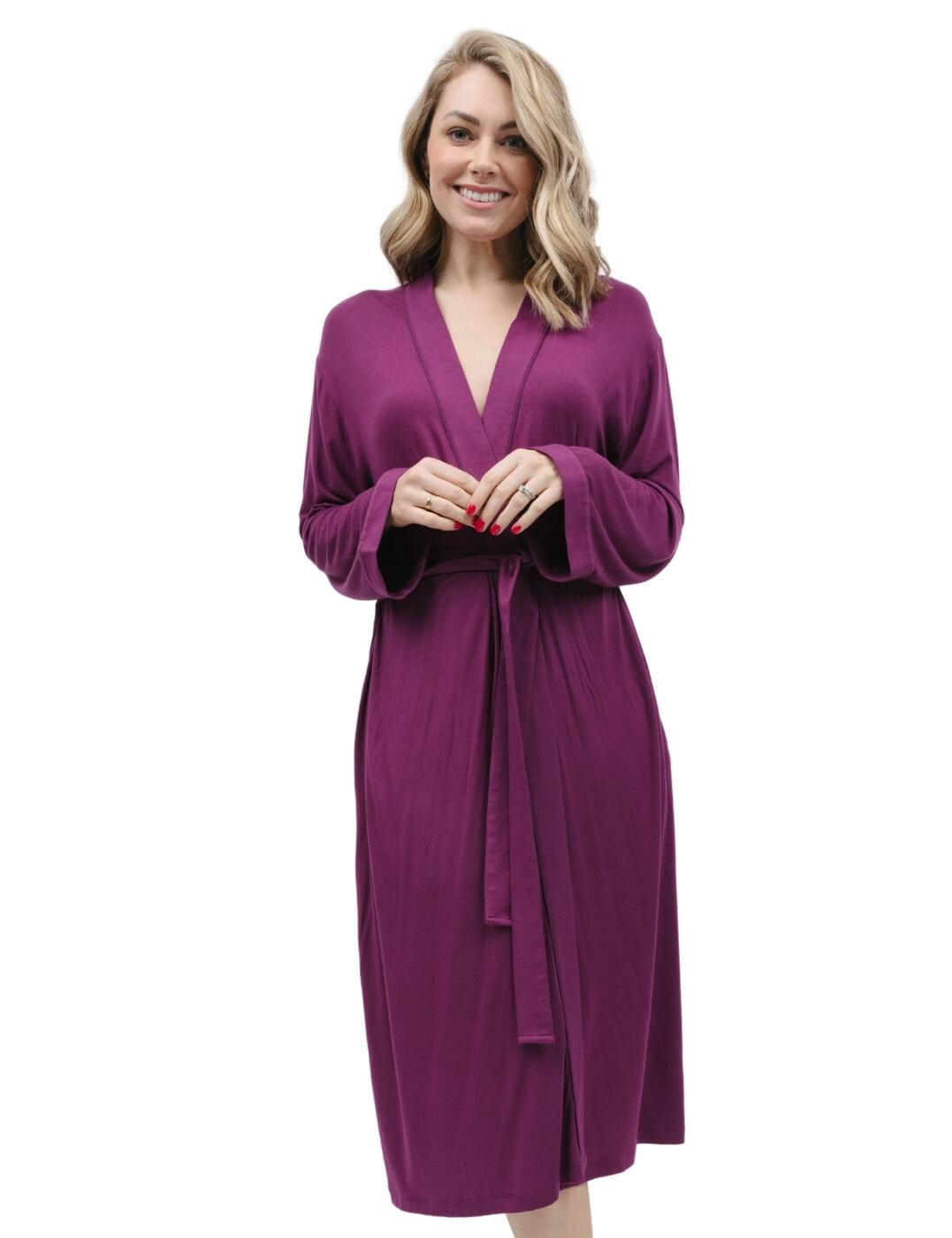 Classic elegance, modern design and effortless style. It has to be the Cyberjammies Carina jersey long dressing gown. A gentle softness, draping elegantly for a timeless look. This wrap-front, kimono-style dressing gown features an alluring colour and contrasting trims which creates a classic look. A fabric tie waist belt enables a tailored fit. Keeping practicality in mind, two side pockets offer you a place to store your must-have essentials. Enhance your night-time wardrobe with this timeless yet trendsetting addition that redefines comfort without breaking the bank.  Dressing gown Fabric tie waist Wrap front kimono style Long sleeve Front and back length: 115cm Matching coordinates available Country of origin: India Composition: 95% Modal &pipe; 5% Elastane Listed in UK sizes  9796-8 9796 Dressing Gown