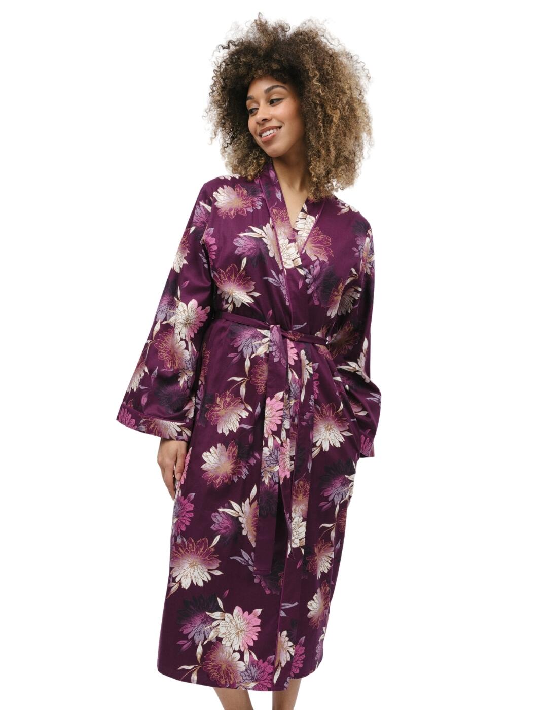 If you're after the epitome of comfort and style all rolled into one then look no further than the Cyberjammies Eve collection. Wrap yourself up in the long dressing gown which showcases a striking large floral print, beautifully contrasted against a captivating bold background. It's a visual feast for the eyes that will have you feeling like the queen. The wrap-front, kimono style design further adds to the sophistication and grace of this dressing gown, and let's not forget about the self-fabric belt fastening, ensuring a snug and secure fit that flatters your figure. the two side pockets offer the convenience you deserve, allowing you to keep your essentials close by. Choose comfort. Choose style. Choose the Cyberjammies Eve collection.  Dressing gown Wrap front A vibrant floral design Contrasting trim Tie waist Calf length Long sleeve Matching coordinates available Country of origin: India Composition: 60% Cotton &pipe; 40% Modal Listed in UK sizes  9854-8 9854 Dressing Gown