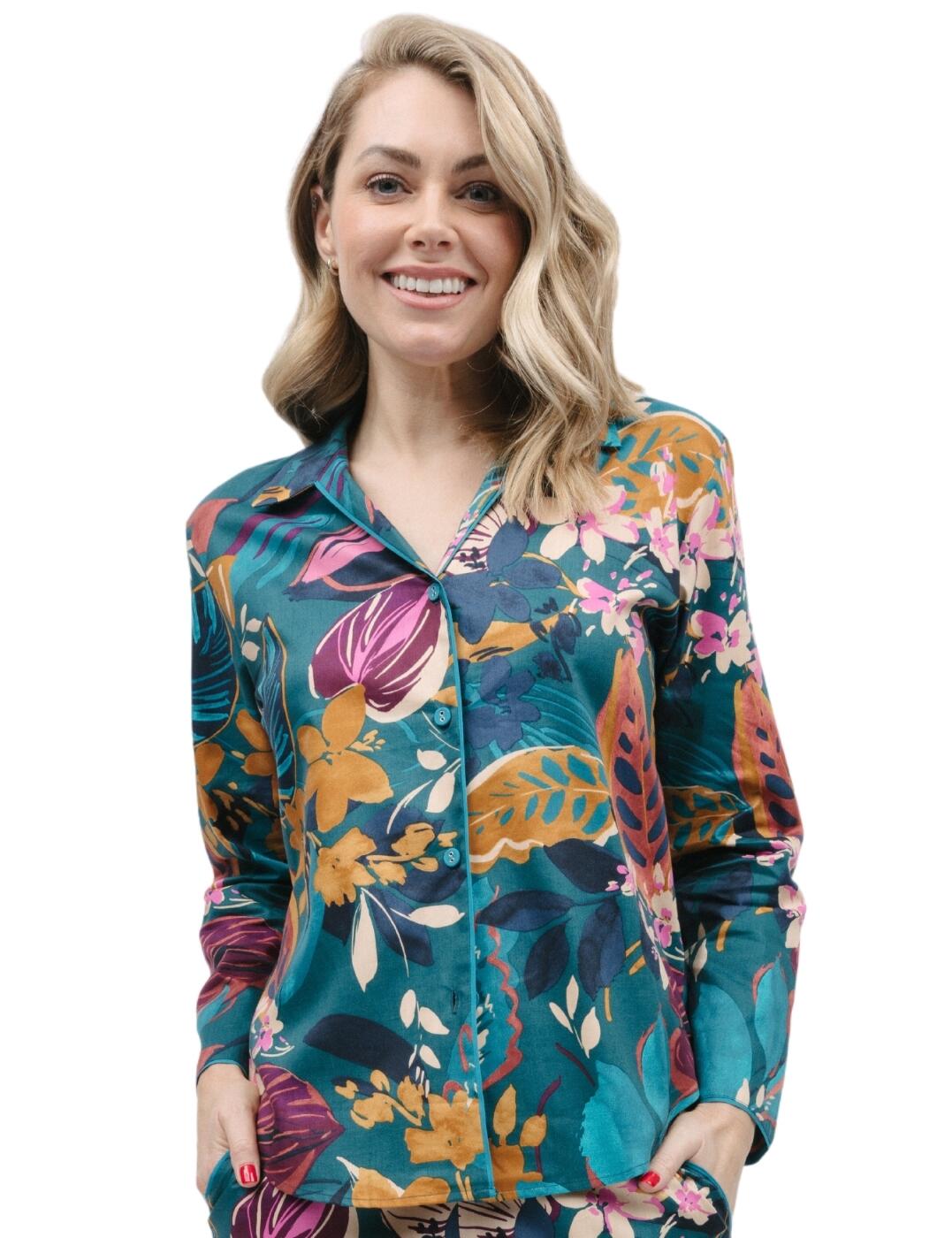 Indulge in the epitome of luxury and comfort with the Cyberjammies Maple pyjama top. Designed for women who crave cosy nightwear, this timeless top is perfect for those colder nights when you just want to relax in style. Crafted from a soft yet breathable fabric, this pyjama top ensures optimal comfort while maintaining a light and airy feel. Featuring long sleeves that can be rolled up for a more relaxed look, and a classic collar, it also has a shaped button hem that allows for a flattering fit. To complete the aesthetic, the luxurious intricate leaf print adds an extra touch of sophistication. For those looking to create a matching lounge set, this item pairs perfectly with other pieces from the Cyberjammies Maple collection.  Pyjama top Comfort and style Long sleeves Button down front Classic collar Shaped button hem makes for a flattering fit luxurious intricate leaf print Matching nightwear is also available Country of origin: India Composition: 60% Cotton &pipe; 40% Modal Listed in UK sizes.  9892-8 9892 Pyjama Top