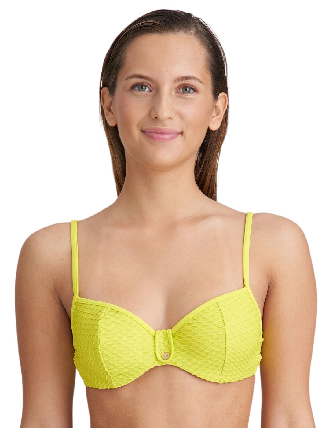 Are you looking for a luxurious, fashionable swimsuit to complete your beach getaway wardrobe this season? Look no further than the Marie Jo Brigitte full cup underwired bikini top. This beautiful waffle print material is designed to make you feel confident and stylish while enjoying the sunshine and taking in the stunning views. With its full cup style design, the padded cups will provide you with ample coverage whilst accentuating your beautiful curves. Adding extra elegance is the button detail centred on the front of the bikini top as well as luxurious adjustable straps that can be fastened with a metallic clasp detail allowing you to find your ideal fit. With underwire support, this luxury bikini top ensures comfort and confidence throughout the day even in those more active moments.