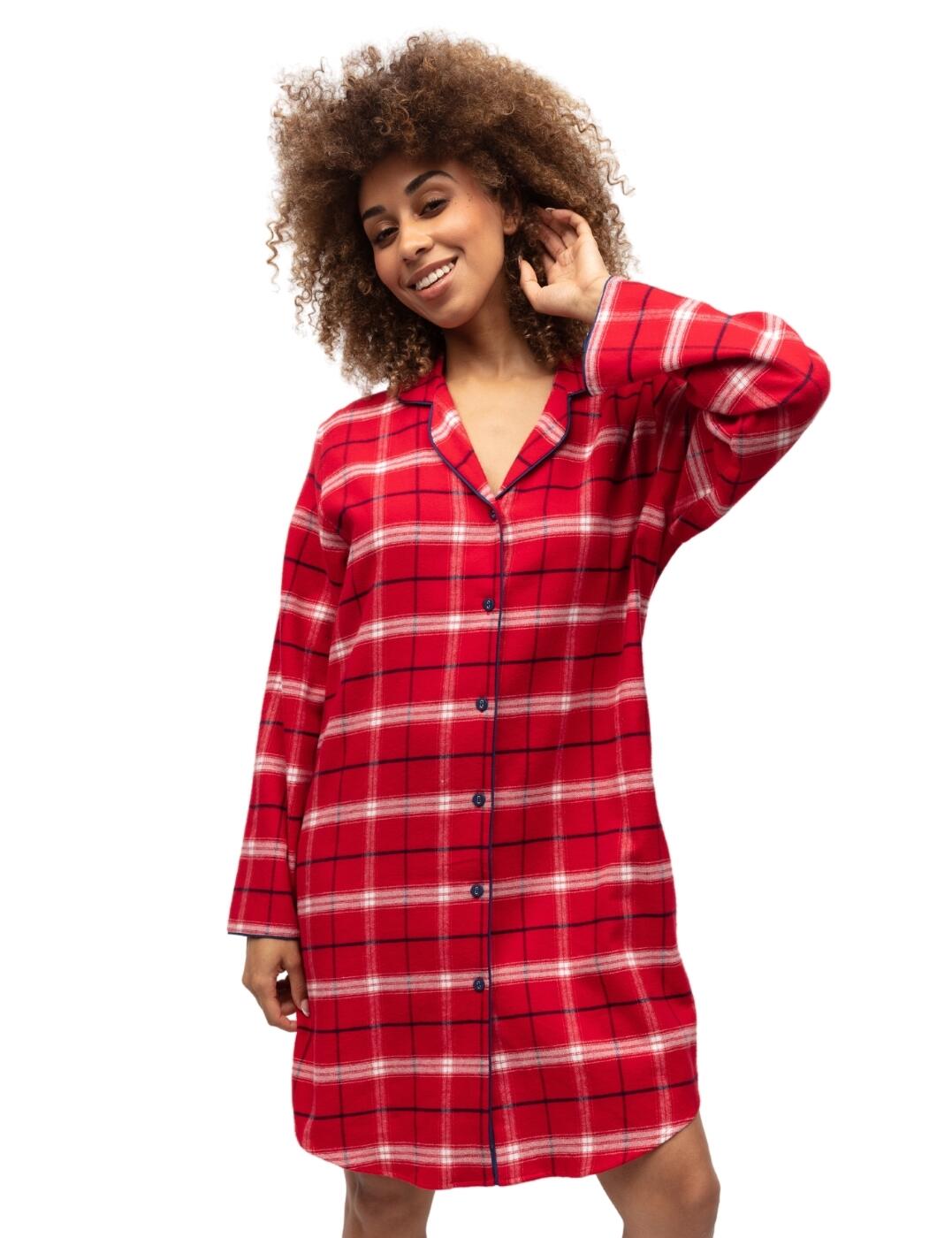 Welcome the festive season in comfort and style with our Cyberjammies Noel nightshirt. This classic nightshirt features a timeless collared and button front design and is made from a soft brushed cotton for an ultra-comfy feel. The long-sleeve and mid length design, makes it perfect for women who want to look stylish yet stay comfortable on chilly nights. Whether you're curling up in front of the fireplace or lounging around on the sofa, this endearing nightshirt is sure to be a favorite addition to your nightwear collection. Wear with timeless coordinating nightwear from the stylish Noel collection by Cyber jammies.  Classic nightshirt Timeless collared and button front design Soft brushed cotton Long sleeve design Above the knee length Matching nightwear available Country of origin: India Composition: 100% Cotton Listed in UK sizes  9884-8 9884 Nightshirt