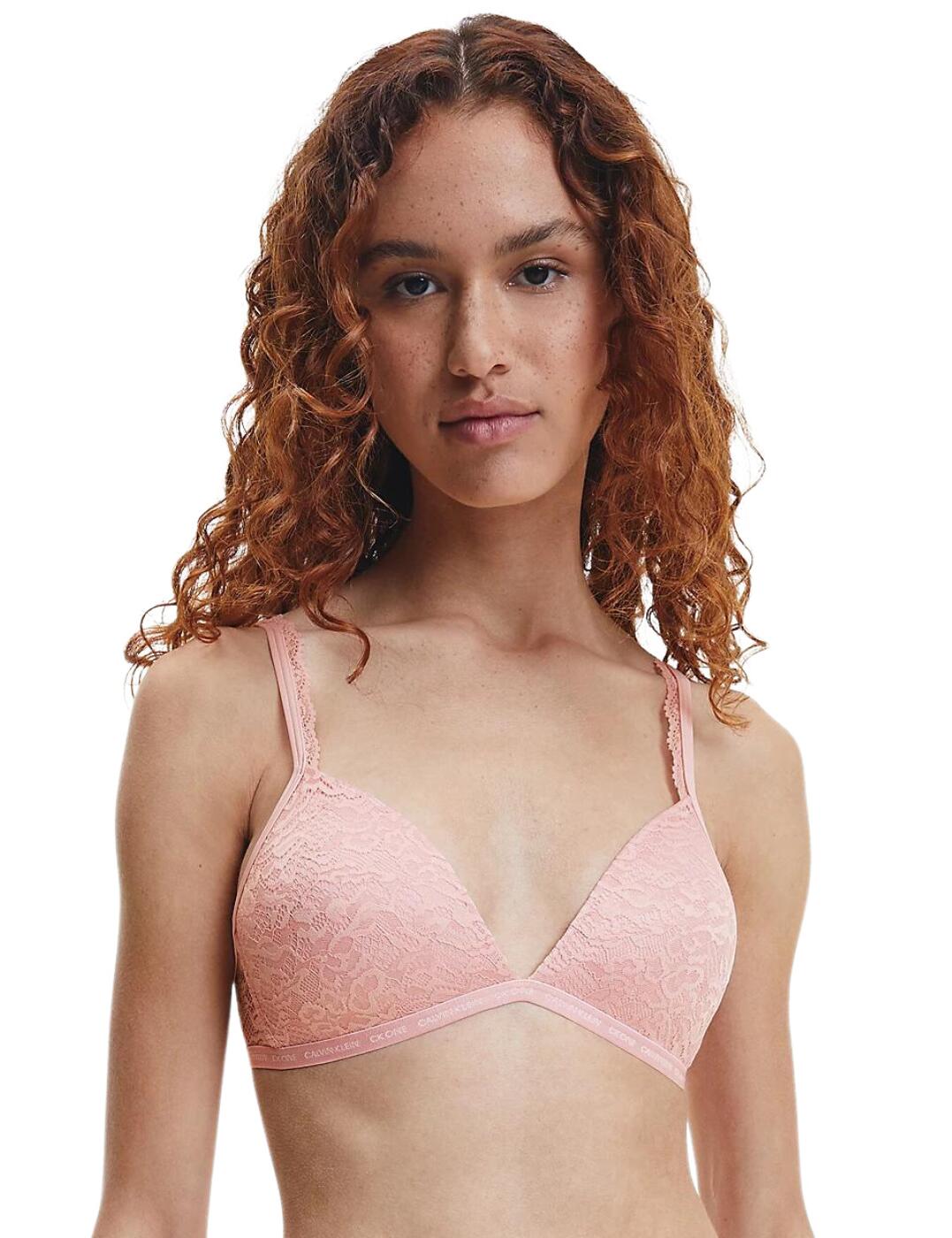 Fall for the grace and femininity of the CK One Lace collection by Calvin Klein. This triangle bra is perfect for daily wear, offering comfort and style. Soft microfibre moulded cups to give you comfortable shaping without padding. A plunging neckline is easily concealed underneath clothing and highlights your cleavage. Delicate lace adorns the cups and shoulder straps giving this bra a feminine and flirty appearance. Partially adjustable shoulder straps and a hook and eye closure allow you to find your most comfortable fit. A wireless design gives you a natural fit and feel while an elasticated underband provides gentle support.  Soft and feminine lace detailing Wireless Moulded cups CK branding Country of origin: Sri Lanka Composition: 90% Nylon &pipe; 10% Elastane Listed in UK sizes  56220-99833 000QF6199E Plunge Bra