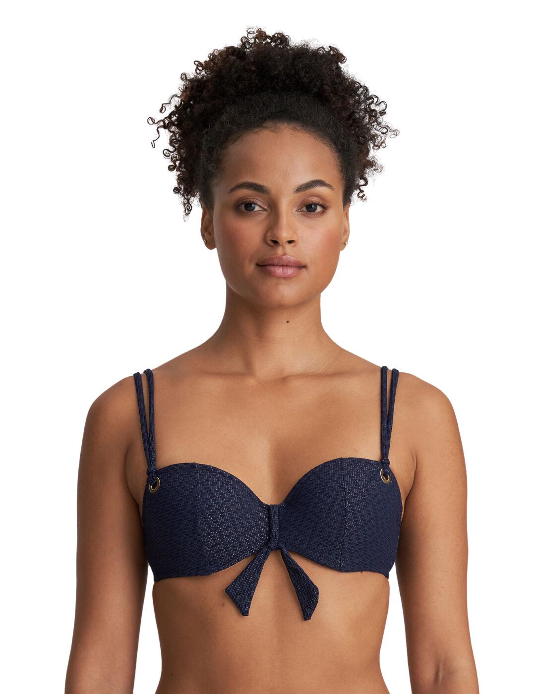 The Marie Jo Valentina padded balcony bikini top is perfect for adding a little glamour to your beachwear this season. The balcony style cups will lift and separate for a defined cleavage. The padding adds extra volume to your bust and also provides excellent coverage, perfect for swimming. The adjustable shoulder straps allow you to find the most comfortable fit. Finished with a charming bow tied around the bridge of the top lending a glamourous and beachy look.  Padded uplifting balcony cups Glamourous bow detail Adjustable shoulder straps Country of origin: Tunisia Composition: 48% Polyamide &pipe; 46% Polyester &pipe; 6% Elastane  Listed in UK sizes  54306-97023-1258723 1003519 Balcony Bikini Top