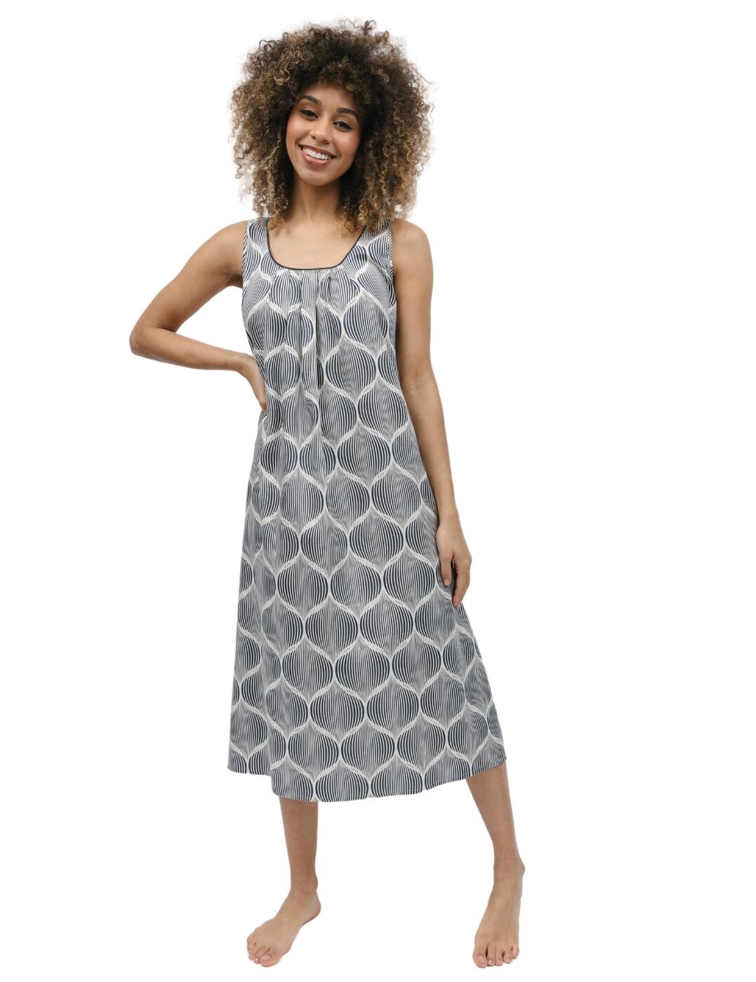 Experience the sweet relaxation of Cyberjammies' Nicole long nightdress and you'll never look at sleepwear the same way again. Soft, breathable, and cool to the touch, this nightdress is made from lightweight materials specifically designed for comfortable rest and peaceful sleep. Delight in its fashionable geo print design, contrasting trimmed edges, wide shoulder straps which provide comfort, and a gently curved neckline that makes it a flattering look on any figure - not to mention front pleats that cascade gracefully down to add a touch of class.  Long nightdress Breathable but cool materials Trendy geo print design Contrasting trimmed edges Wide shoulder straps for comfort Gently curved neckline Front pleats cascade gracefully down Country of origin: India Composition: 60% Cotton &pipe; 40% Modal Listed in UK sizes  9769-8 9769 Nightwear