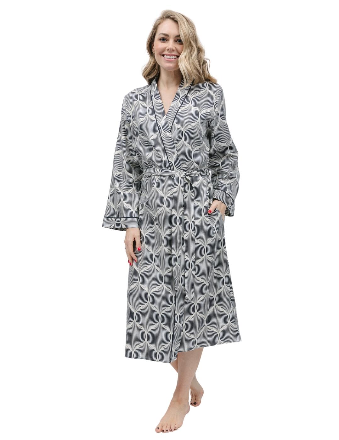 Take your lounging style to a whole new level with Cyberjammies’ Nicole long dressing gown. Designed with ultimate comfort in mind, this luxurious piece is made with super soft fabrics for the cosiest fit. Crafted in a trendy geo print design and contrasting trims, you won’t find a more stylish way to relax. The wrap front makes it great for layering over other pieces in your nightwear wardrobe, while two side pockets offer practical convenience without spoiling the perfect silhouette. You can also pair it with the matching coordinates available for a seamless look that’s ready to impress.  Long dressing gown Trendy geo print design Super soft fabrics Kimono style Contrasting trims Wrap front with self-fabric belt Two convenient side pockets Loose long sleeves Matching coordinates available Country of origin: India Composition: 60% Cotton &pipe; 40% Modal Listed in UK sizes  9770-8 9770 Dressing Gown