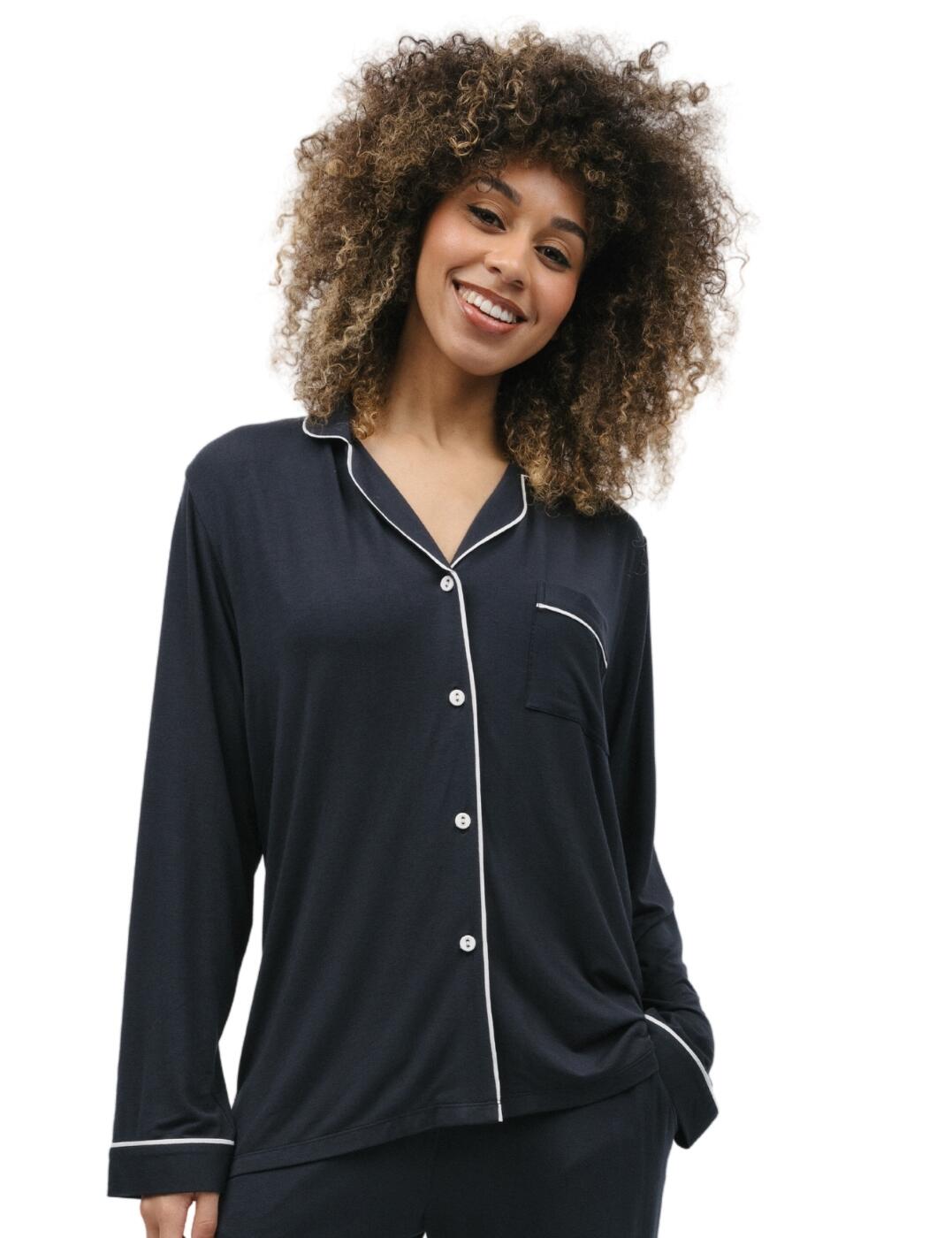 Lounge in pure comfort and style with the Cyberjammies Nicole knit pyjama top. This simple and elegant top easily elevates any bedtime or chill-out look. Crafted from breathable and soft fabric, it’s designed with a delicate revere collar and flattering contrast trims which adds style and sophistication to your pyjama set. Not to mention, its button-down design and single convenient pocket allow complete convenience while wearing. Plus, matching coordinates are available separately so you can aim for the full sleepwear ensemble.  Knit pyjama top Simple, elegant style Breathable and soft fabric Contrasting trims Revere collar for a refined look Single convenient pocket Button-down design Matching coordinates available Country of origin: India Composition: 95% Modal &pipe; 5% Elastane Listed in UK sizes  9877-8 9877 Loungewear