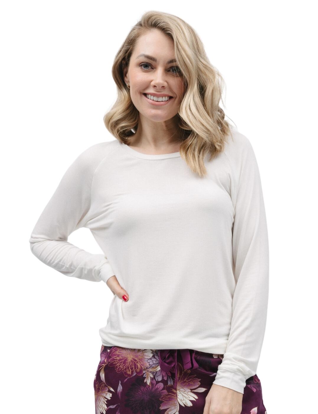 Bring chic comfort into your nighttime wardrobe with the Cyberjammies Nicole knit pyjama top. This stylish top, crafted from super soft and cosy fabrics, offers a slouch knit feel with a simple, block design. The rounded neckline gives the shirt a relaxed fit and a very elegant touch. With long sleeves for additional warmth and the raglan sleeve finish, you'll love how the self-fabric trims add even more of a fashionable flair. The Cyberjammies Nicole knit pyjama top pairs easily with your favourite pyjama bottoms, making it the perfect go-to lounge set.  Slouch knit pyjama top Simple, block design Soft and cosy fabrics Rounded neckline Long sleeves for warmth Raglan sleeves add an elegant touch Self-fabric trims Easily paired with your favourite pyjama bottoms Country of origin: India Composition: 95% Modal &pipe; 5% Elastane Listed in UK sizes  9778-8 9778 Loungewear