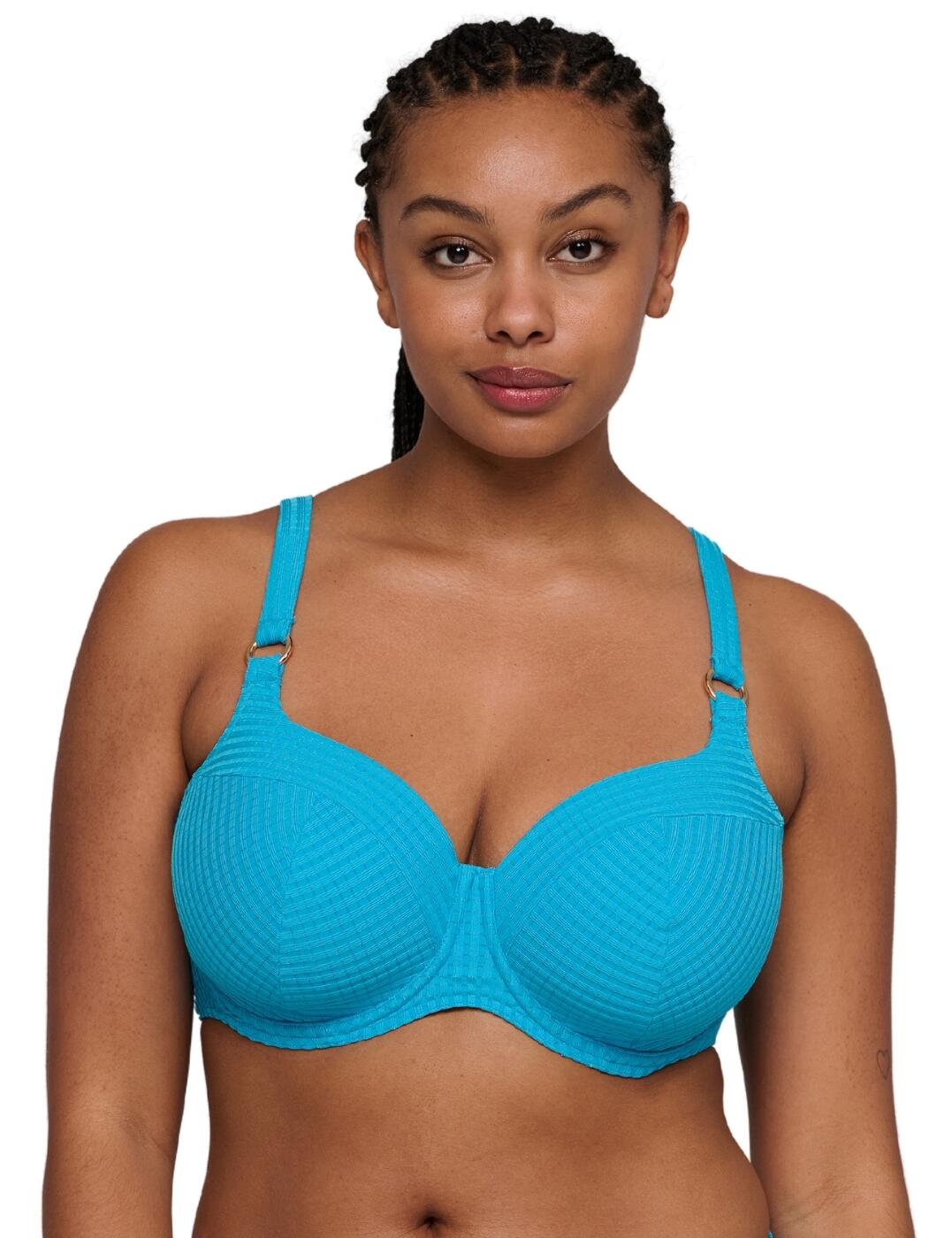 Perfect your poolside look with the Kochi padded heartshape bikini top by Prima Donna Swim. Featuring a heart-shaped neckline and soft, padded cups, this chic underwired bikini top offers reassuring support to effortlessly enhance your natural curves. The textured stripe fabric exudes sundrenched sophistication, while metallic ring accents at the apex add touches of glamour fit for any luxury getaway. For customisable couture, adjustable, multiway straps offer a versatile halterneck option, ensuring each and every wear is perfectly suited to your style, while a discreet plastic clasp closure secures at the back. Pair with matching Kochi swimwear for effortless beach elegance.