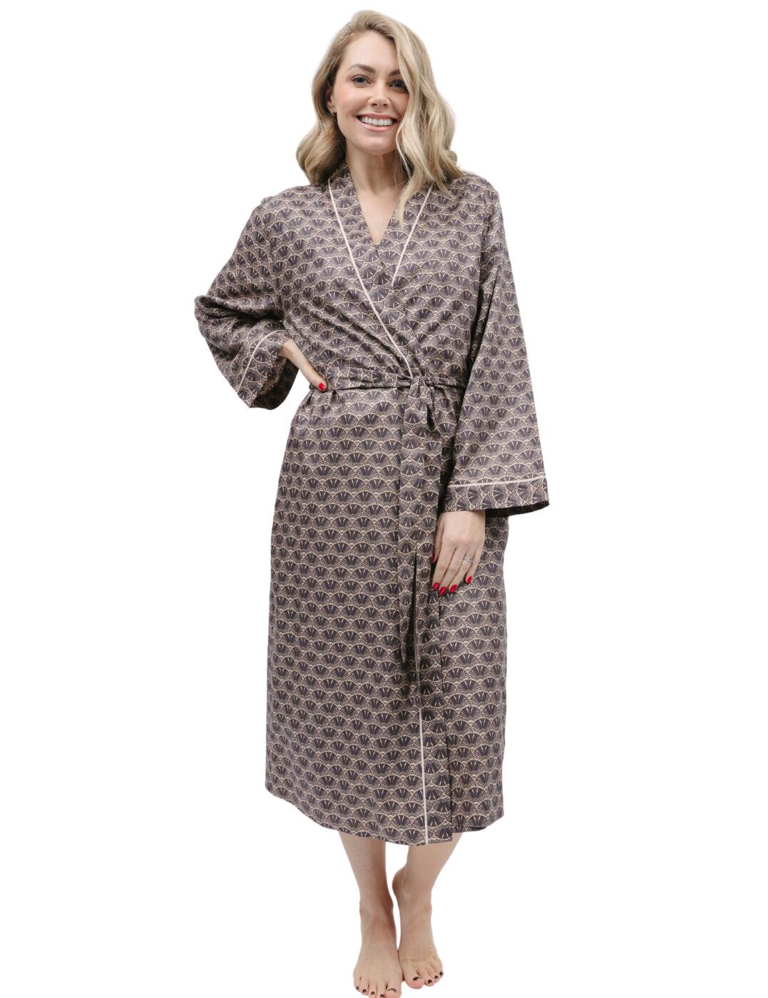 Discover ultimate luxury and comfort with the Cyberjammies Lana long dressing gown. This stunning 3/4 length kimono-style dressing gown is crafted from stylish fabric to give you an indulgent feel during your downtime. Featuring a stylish, belt-tie waist and beautiful design, it's no surprise this gorgeous sleepwear garment will be the only choice for so many. Whether you're getting ready for the day or lounging after hours, this stylish long dressing gown takes comfort to new heights while keeping you looking chic and sophisticated.  Stylish long dressing gown Kimono style Belt tie waist 3/4 length Comfortable and stunning design Matching sleepwear available Country of origin: India Composition: 60% Cotton &pipe; 40% Modal Listed in UK sizes  9821-8 9821 Dressing Gown