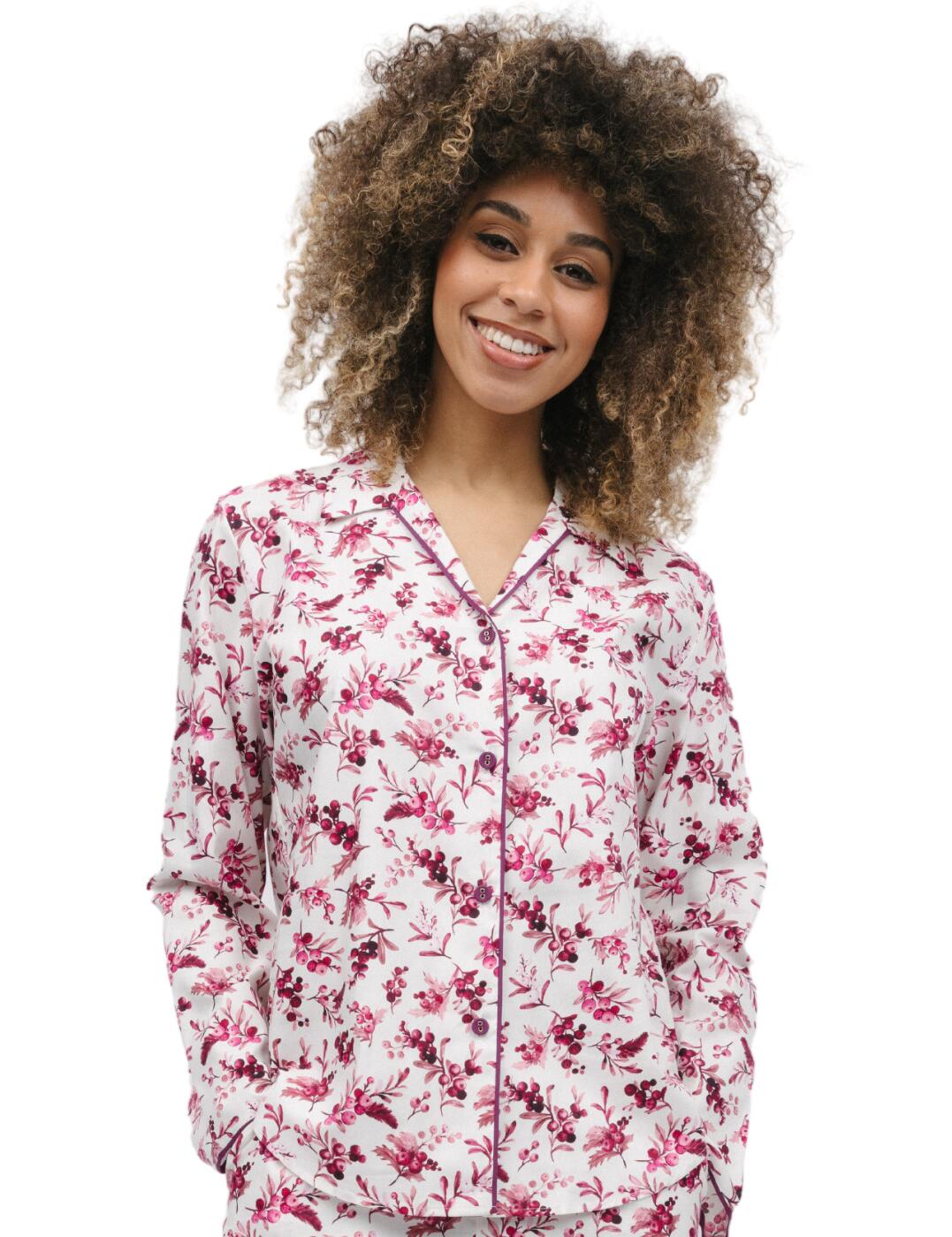 Stay cosy and stylish in the Cyberjammies Eve pyjama top this winter! This nightwear essential is made from a soft and comfortable fabric that is both easy to wear and easy to care for. The cute print comes alive with the elegant trims, creating a unique and stylish look. The classic pointed collar and easy button-down front gives the top an extra fashionable touch. Plus, the shaped bottom hem creates a flattering fit and allows for full freedom of movement when you’re lounging around in the evening. The long sleeves add extra comfort to the top. To complete the look, a range of matching pieces are also available.  Pyjama top Nightwear essential Cute print with elegant trims Comfortable fit Easy button-down front Classic pointed collar Shaped bottom hem creates a flattering fit Long sleeves Matching pieces are also available Country of origin: India Composition: 60% Cotton &pipe; 40% Modal Listed in UK sizes  9855-8 9855 Pyjama Top