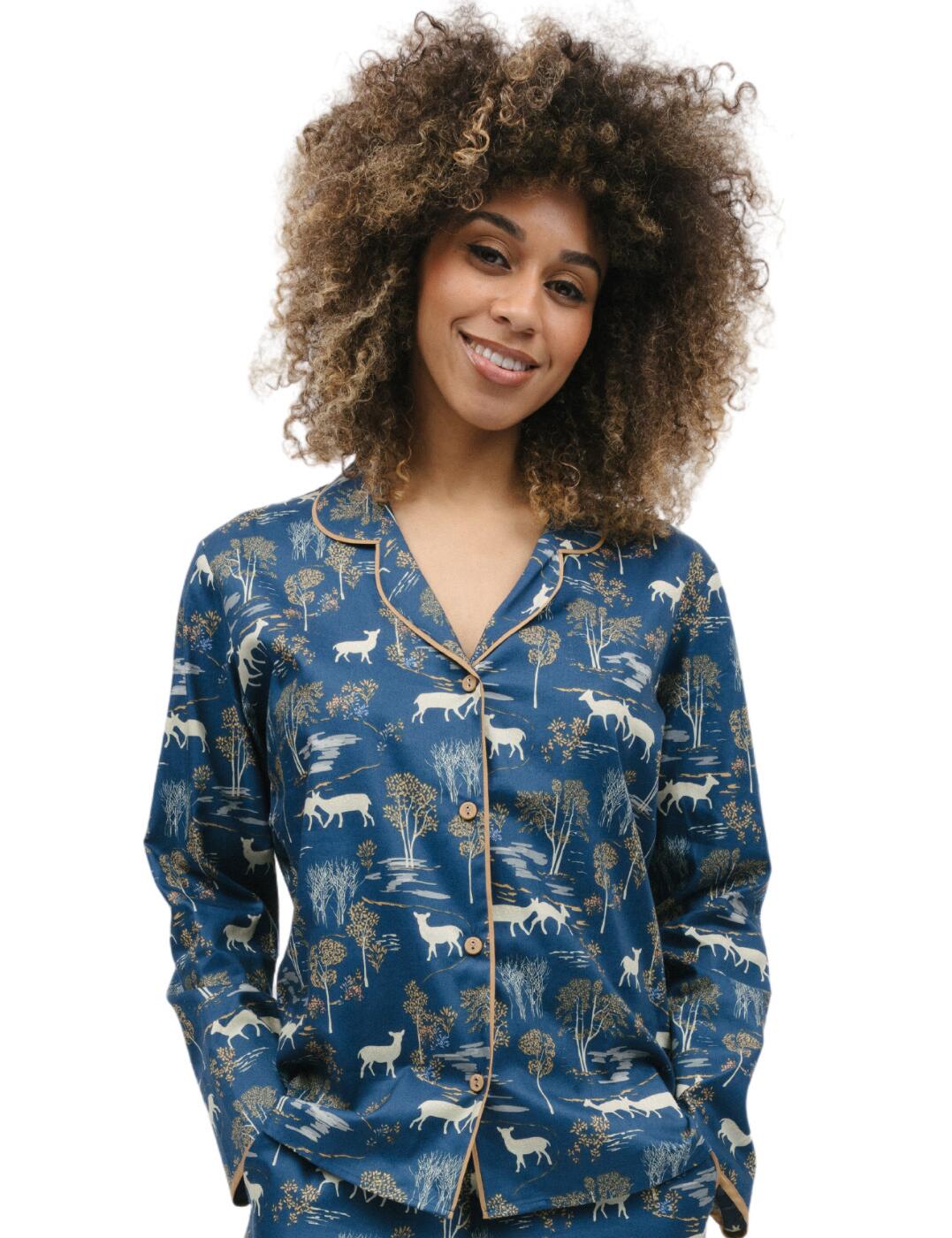 Experience luxurious comfort with the Cyberjammies Fawn pyjama top. Crafted with a timeless design but elevated with charming prints and luxurious trims, the pyjama top is a classic option for those seeking a cosy nightwear option. With a revere collar and buttons down the front, this garment provides the perfect fit for keeping you relaxed and comfortable as you drift off. The top is designed to be matched with other items in the Cyberjammies Fawn range, which includes a variety of styles, from trousers to nightdresses, to create the perfect nightwear ensemble.  Pyjama top Long sleeves Revere collar Buttons down the front Timeless design Charming print with luxurious trims Matching items are also available Country of origin: India Composition: 60% Cotton &pipe; 40% Modal Listed in UK sizes  9824-8 9824 Pyjama Top