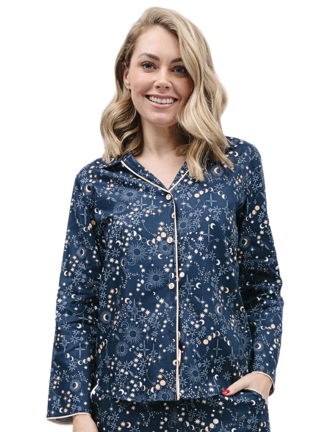 Break the cycle of dull, everyday sleepwear with the Cyberjammies Cosmo pyjama top! With its celestial print, long sleeves, pointed collar, and button-down closure, you can be sure to be on trend and stay snuggled up all night long. Comfort doesn’t stop at looks either - this pyjama top is designed for you to look and feel your best. The shaped bottom hem flatters your silhouette while the contrasting modal trims exude elegance. Complete the look with the additional matching coordinates for a stunningly modern look.  Comfy pyjama top Stylish celestial print Long sleeves for warmth Pointed collar Contrasting trims for elegance Button-down Shaped bottom hem flatter silhouette Matching coordinates available Country of origin: India Composition: 60% Cotton &pipe; 40% Modal Listed in UK sizes  9801-8 9801 Loungewear