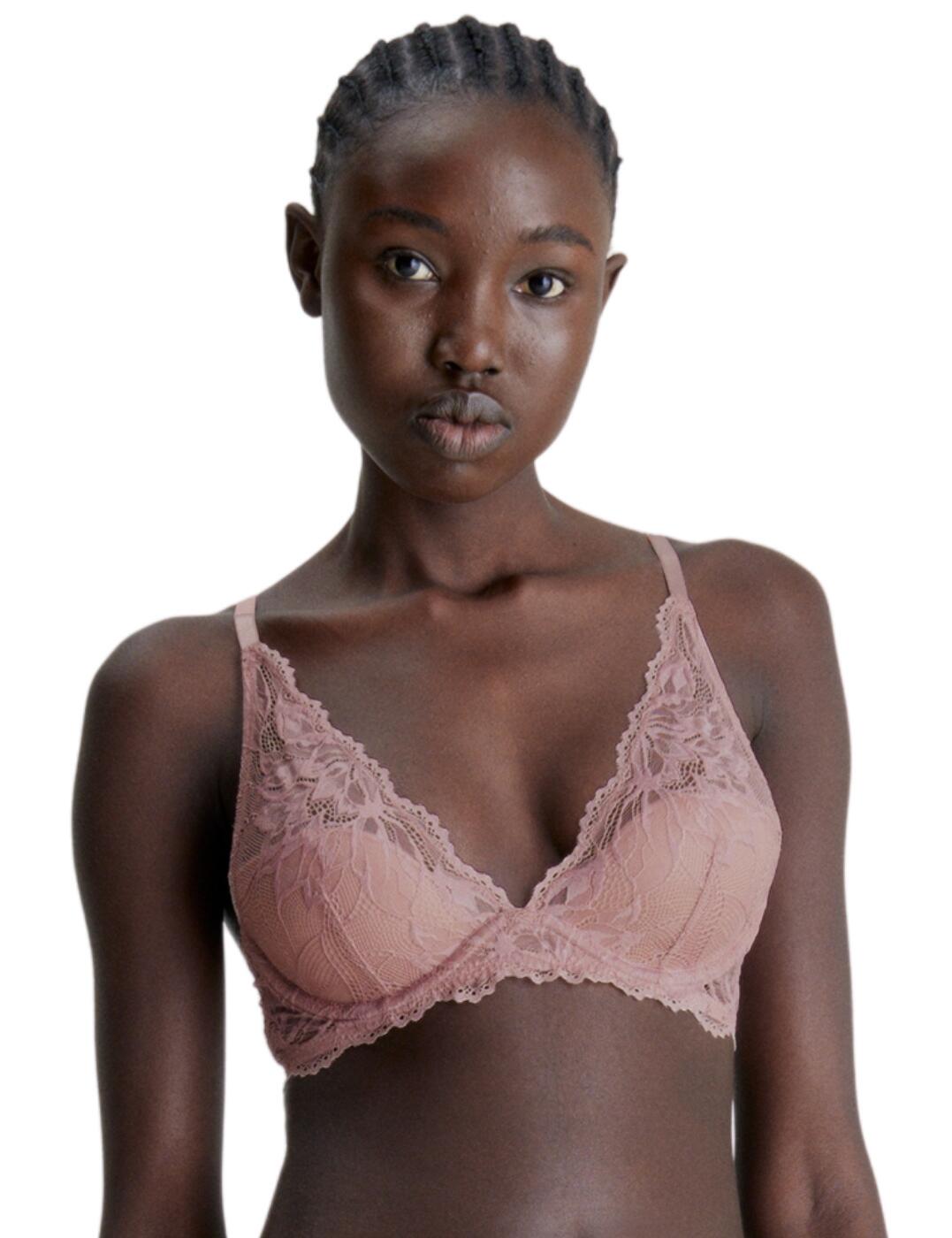 Step up your lingerie game and add the Calvin Klein Seductive Comfort plunge bra to your wardrobe! This chic, lace bra was designed with support and comfort in mind. The moulded demi cups provide support and underneath you’ll find supportive underwires. The material used is a combination of sheer lace and soft microfiber, giving the perfect blend of fashion and functionality. The scalloped lace wings and Calvin Klein tag on the left shoulder add a stylish, designer finish. With adjustable shoulder straps and hook and eye closure for a perfect fit, this plunge bra will soon become your favourite! And a vast range of matching coordinates are available so you can complete your look.  Lace bra Plunging neckline Sheer lace and microfibre Moulded demi cups Underwired for support Non-padded for comfort Scalloped lace wings Calvin Klein tag on the left wing Adjustable shoulder straps Hook and eye closure Matching coordinates available Country of origin: Thailand Composition: 86% Polyamide &pipe; 14% Elastane Listed in UK sizes  62527-107890-1430476 000QF6396E Plunge Bra