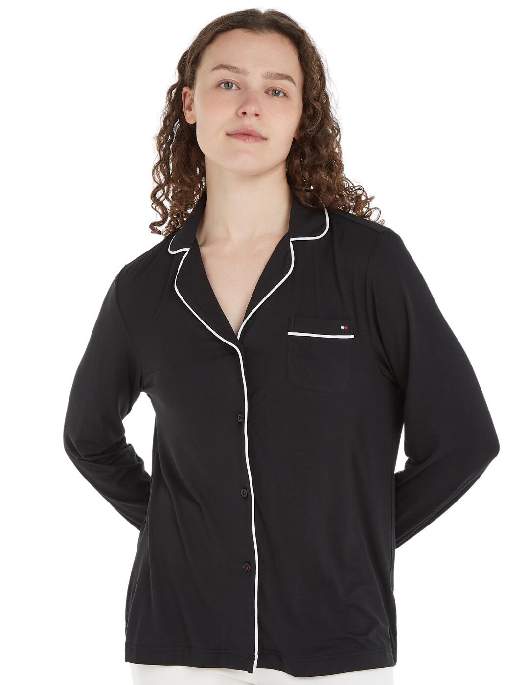 Dress up your nighttime routine with this classic pyjama top from Tommy Hilfiger. It s crafted from the finest fabric and designed to deliver premium comfort combined with timeless style. Featuring a classic button-up collared design with an elegant piping detail and a front pocket for added convenience, this pyjama top will turn any night into an occasion. With long sleeves and luxurious fabric, it's a cozy way to lounge at home while looking chic and stylish. It s a timeless piece that will bring you total comfort and classic sophistication for years to come. Stylish coordinating nightwear is available by Tommy Hilfiger.