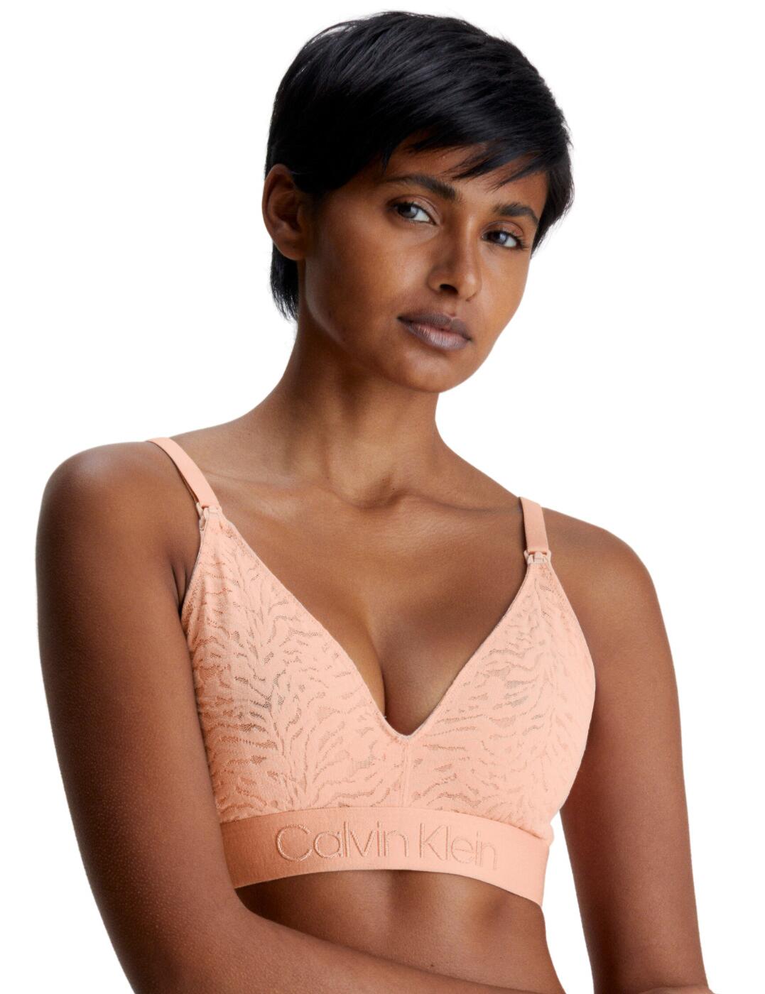 Welcome to comfort and style with the Calvin Klein lace maternity bra. Calvin Klein's maternity bras are designed to fit and support you throughout every stage of your pregnancy, giving you ultra-feminine and comfortable style you’ll love. Crafted to accommodate your changing shape, this bra has everything you need to keep your curves supported, starting with the stretchy lace cup for day-long comfort. The lightly lined soft cups provide the perfect amount of support, with an integrated inner cotton sling and the signature Calvin Klein elastic underband, this bra sits smoothly against skin, giving you all-day comfort as you move through your day. With the drop-down clips, you can easily transition to nursing mode, with adjustable shoulder straps for added support and flexible fit. Get the ultimate in premium designer lingerie with this Calvin Klein lace maternity bra.  Soft inner sling Hook and eye fastening Stretch lace Non-padded Drop-down nursing clips for quick access Adjustable shoulder straps Wireless Stretch underband Country of origin: Sri Lanka Composition: 83% Nylon &pipe; 17% Elastane Listed in UK sizes  62872-108299-1436965 000QF6631E Maternity Bra