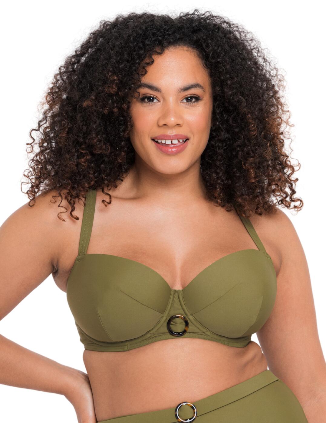 Radiate style on the beach or by the pool with this bikini top from the gorgeous Retro Sun collection by Curvy Kate. The single-tone design is given a trendy 70's vibe with a tortoiseshell buckle in the centre, easily bringing attention to your beautiful decolletage. A traditional balcony-style neckline with underwired moulded cups provides an uplifted look with a secure fit. The fully adjustable shoulder straps can be worn in a multitude of combinations, giving you the freedom to adapt the design to your most comfortable fit. Match with bikini briefs from the Retro Sun collection for a coordinated look.  Classic balcony-style neckline Retro look with a tortoiseshell buckle Material resistant to heat, chlorine and sunscreen Fully adjustable multiway shoulder straps Plastic barrow clasp closure Underwired Moulded cups Matching coordinates available Country of origin: China Composition Main: 80% Nylon &pipe; 20% Xtra Life Lycra Composition Lining: 100% Polyester Composition Lining 2: 100% Nylon Composition Wing Mesh: 73% Nylon &pipe; 27% Elastane Listed in UK sizes  58222-102553-1337111 CS019300 Balcony Bikini Top